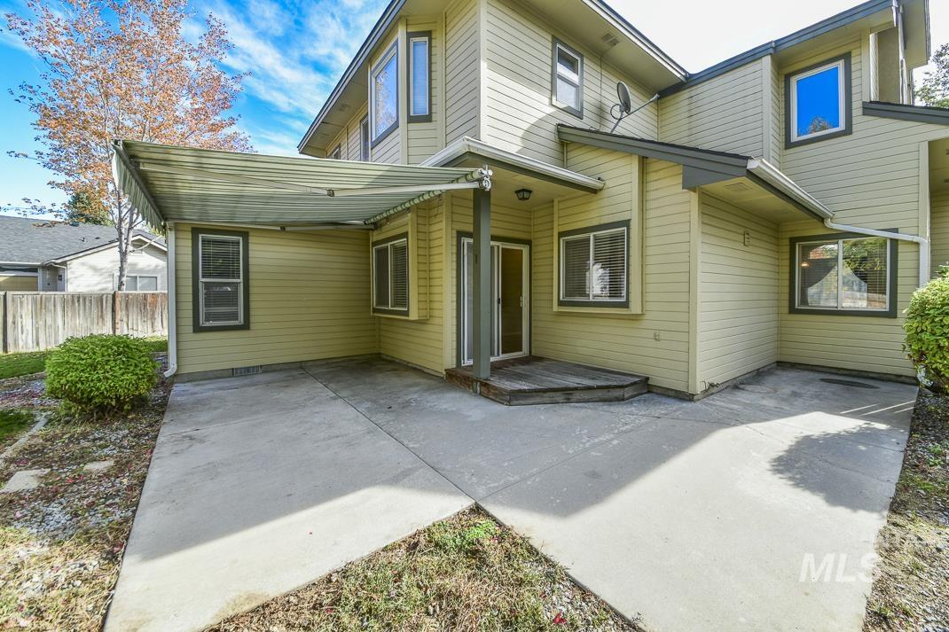 Back of property with a patio