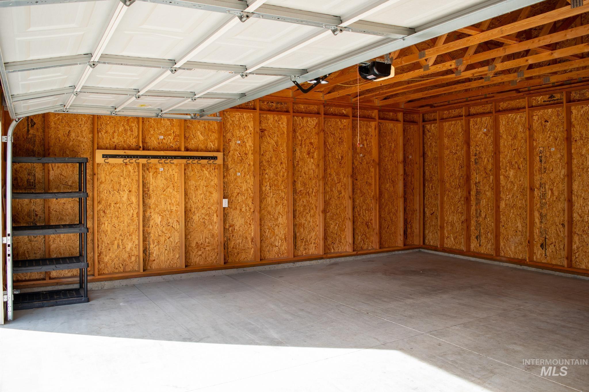 Garage featuring a garage door opener