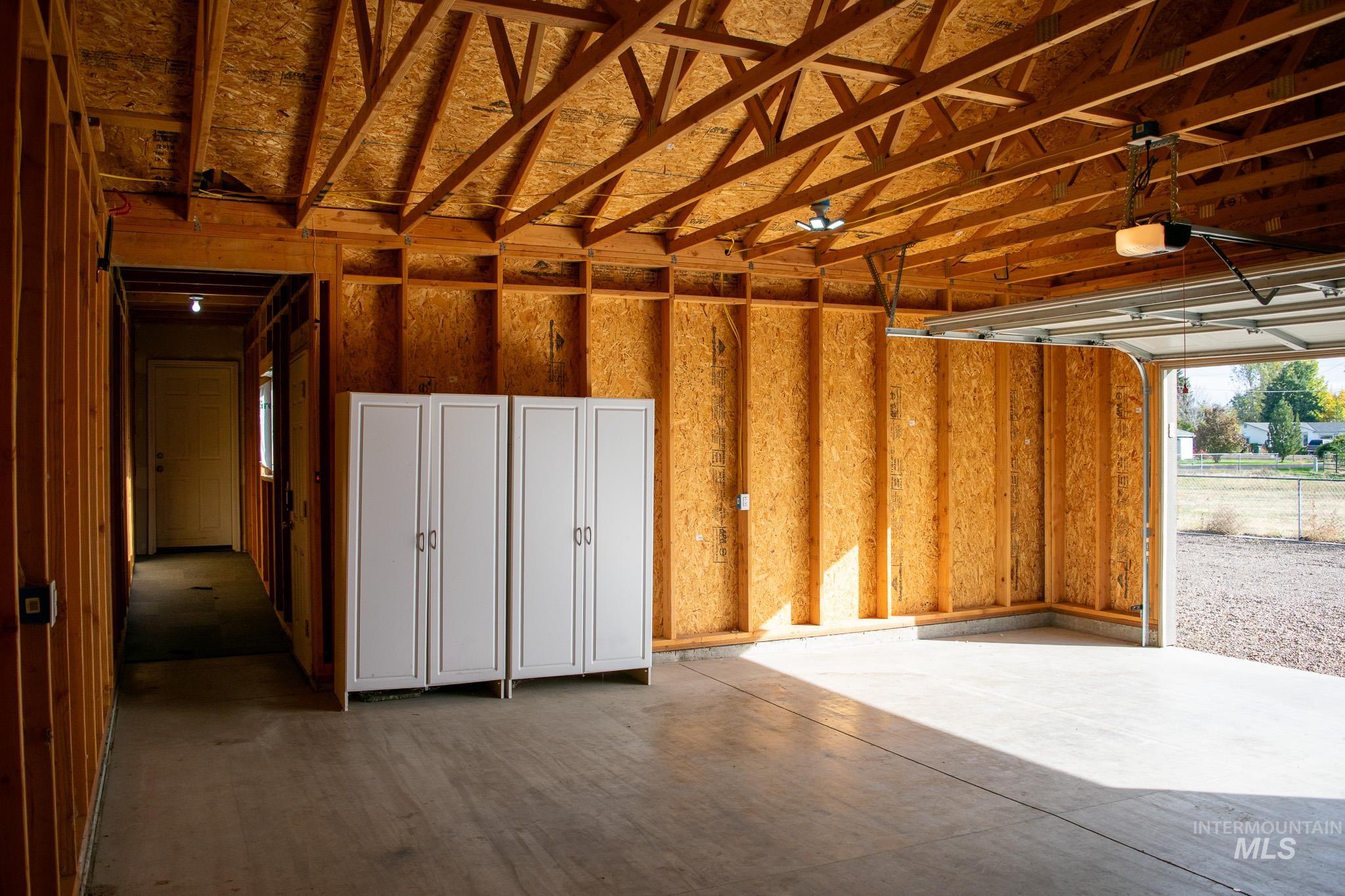 Garage featuring a garage door opener