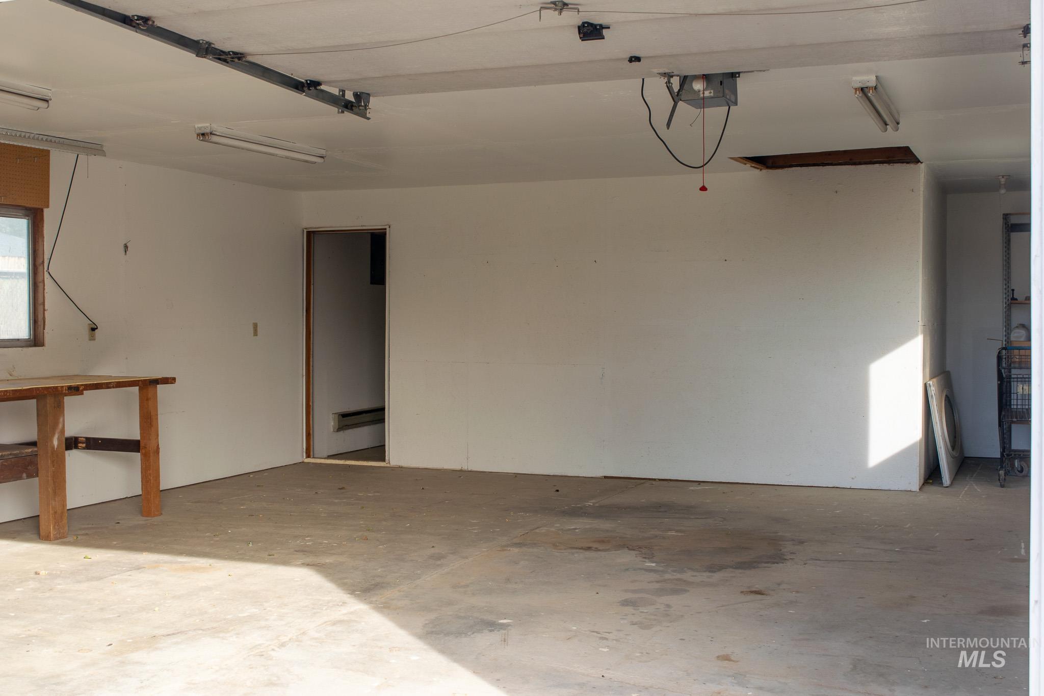 Garage featuring a garage door opener