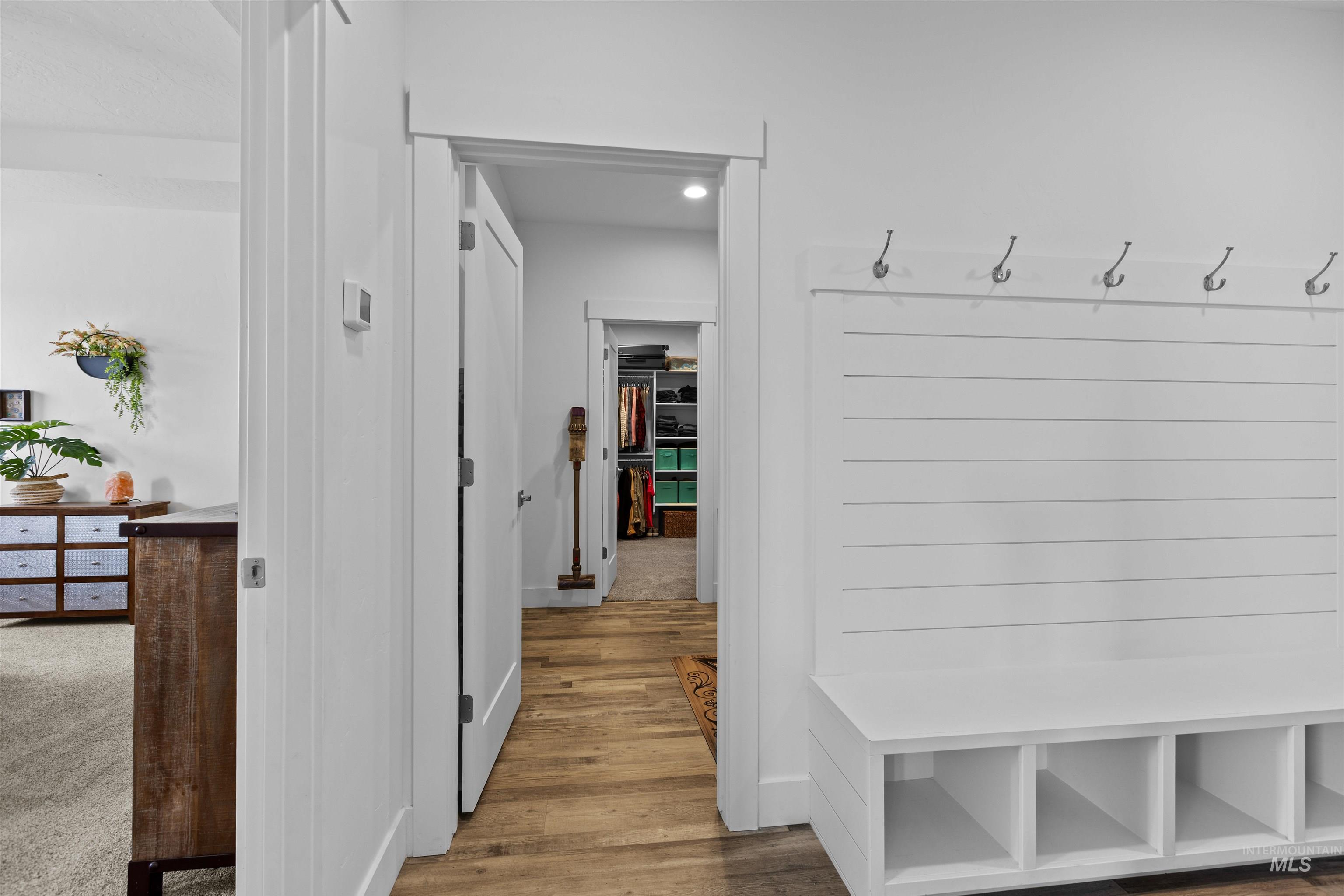 Mudroom with light wood-style floors
