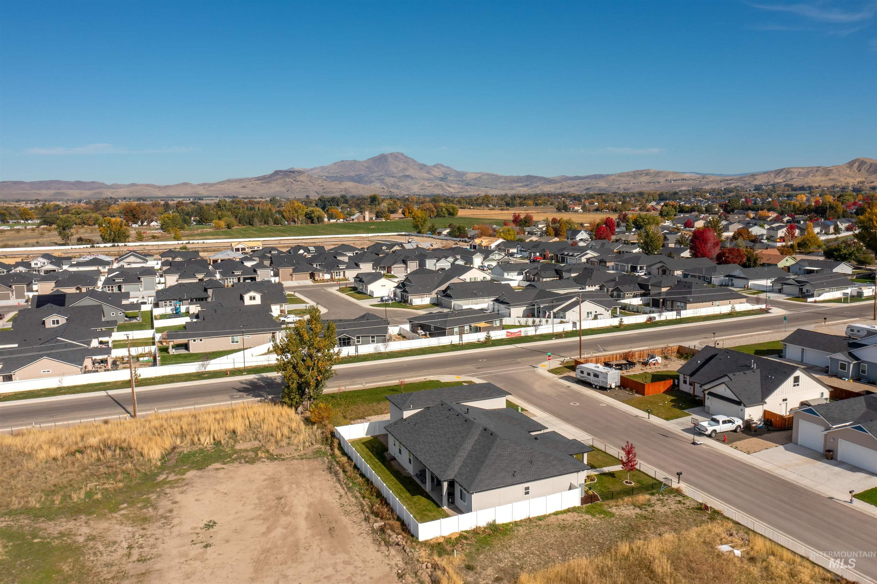 Aerial view of residential area with a mountainous background