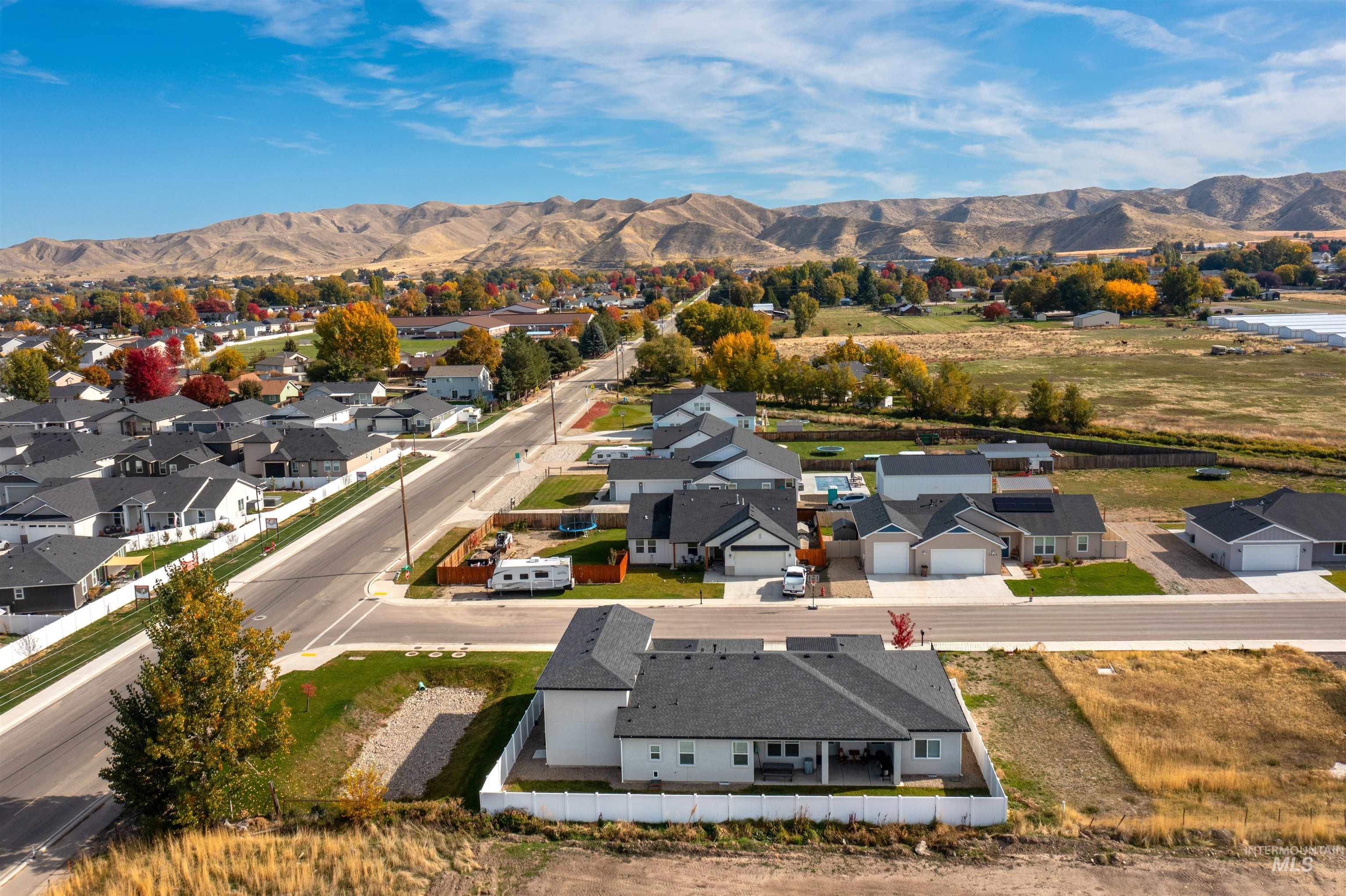 Aerial view of residential area featuring mountains