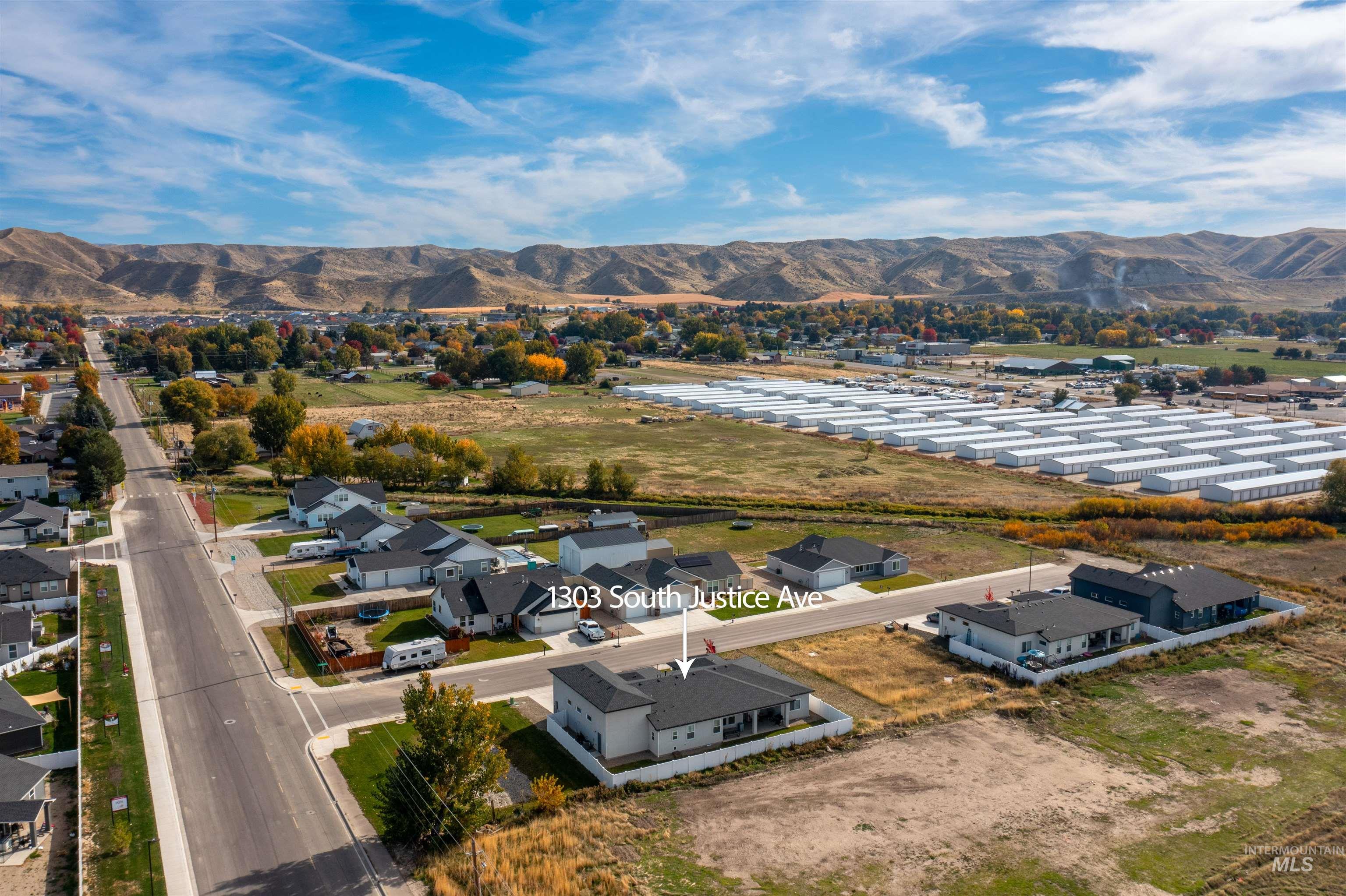 Aerial perspective of suburban area featuring a mountainous background