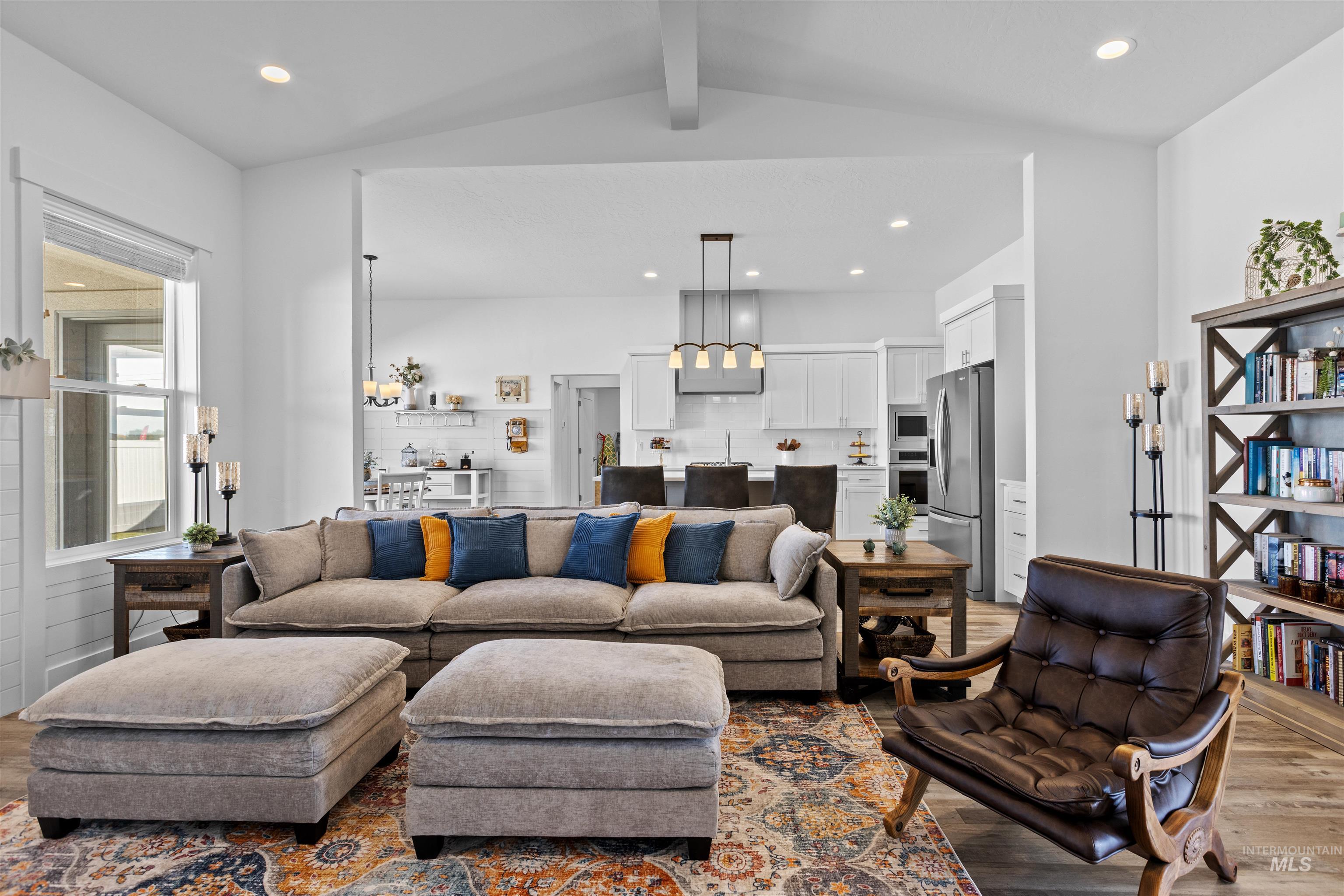 Living area with dark wood-style floors and recessed lighting
