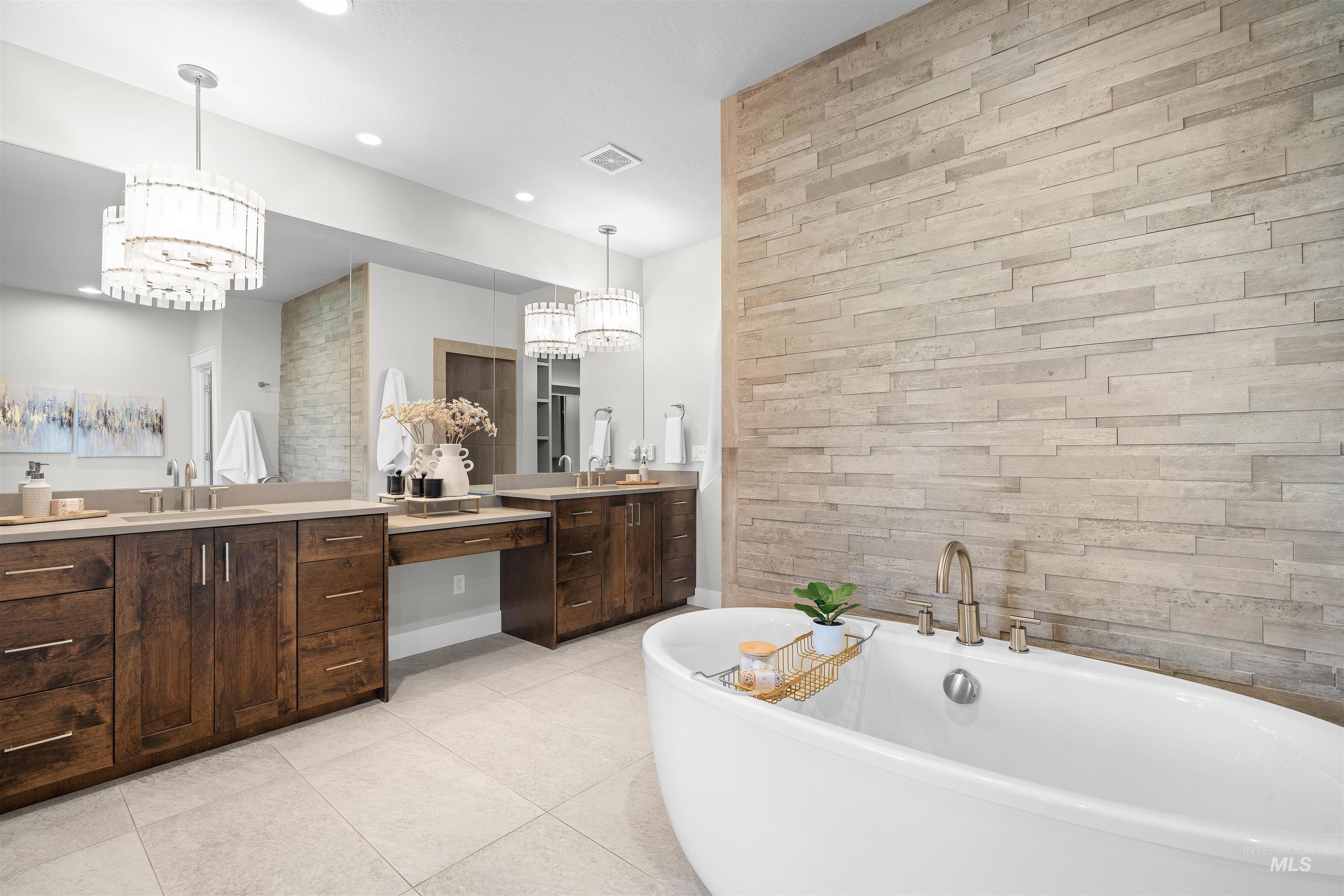 Full bath with vanity, a freestanding bath, light tile patterned flooring, wooden walls, and recessed lighting