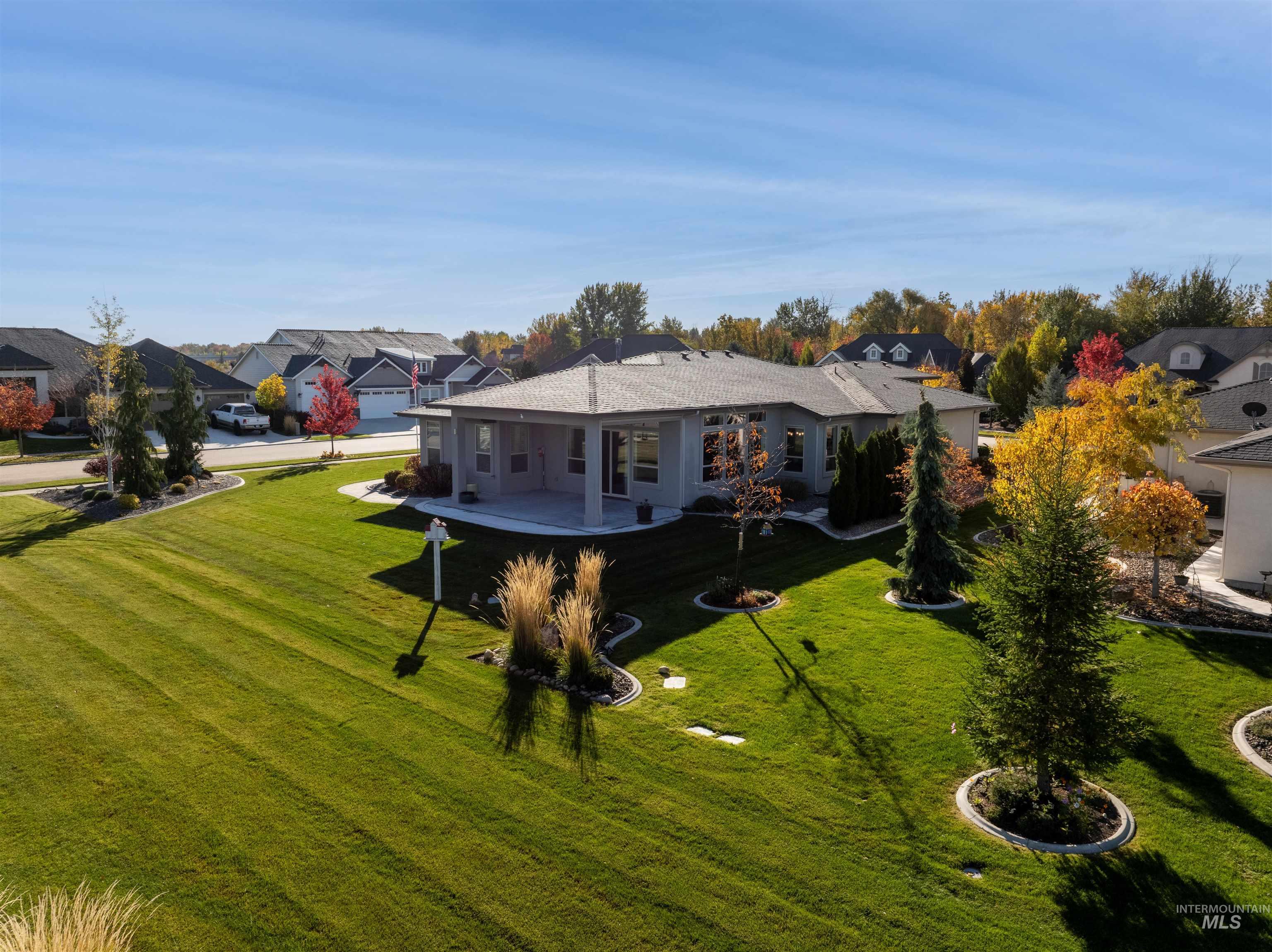 Rear view of property with a residential view and a lawn