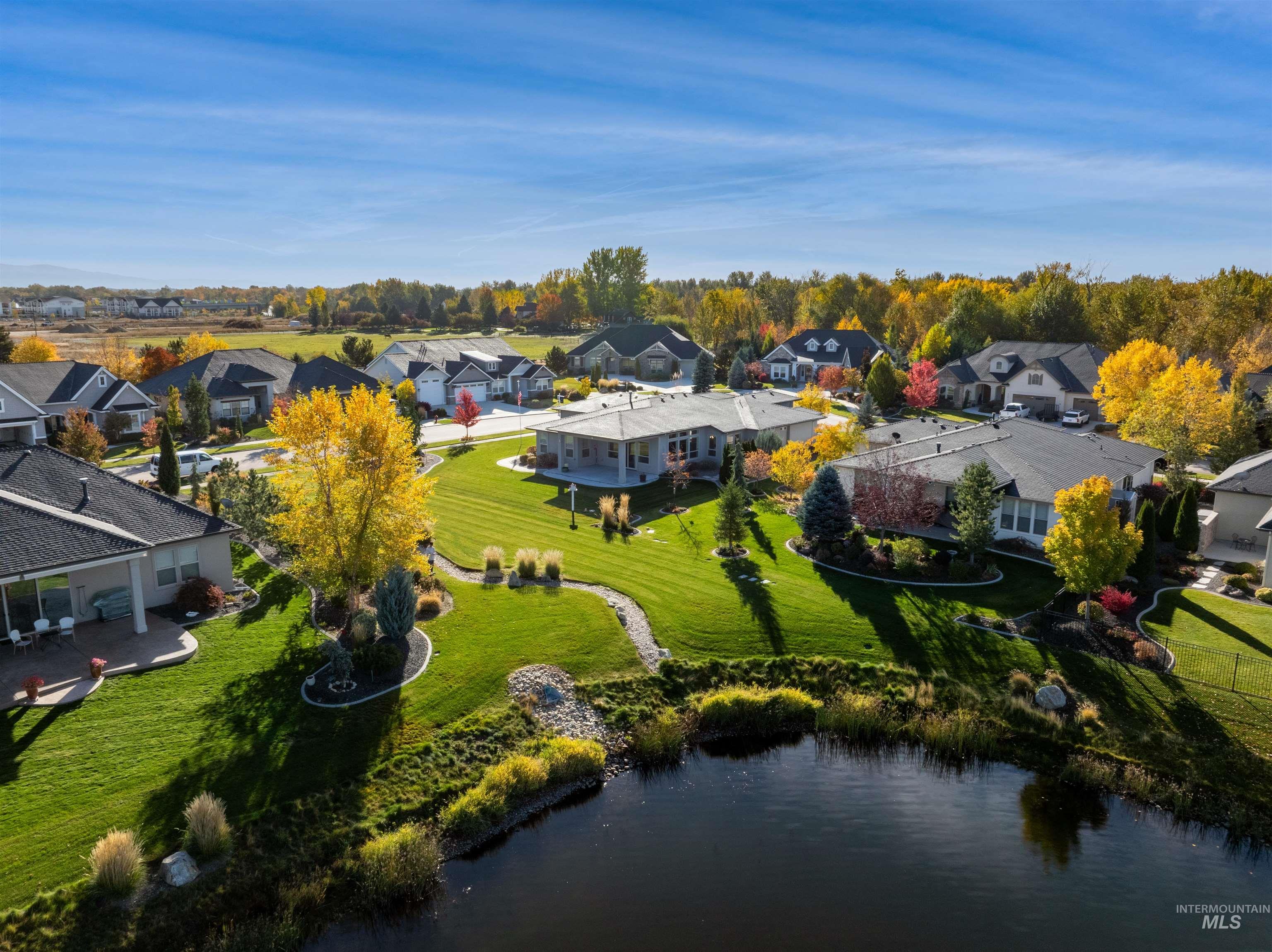 Aerial perspective of suburban area with a nearby body of water