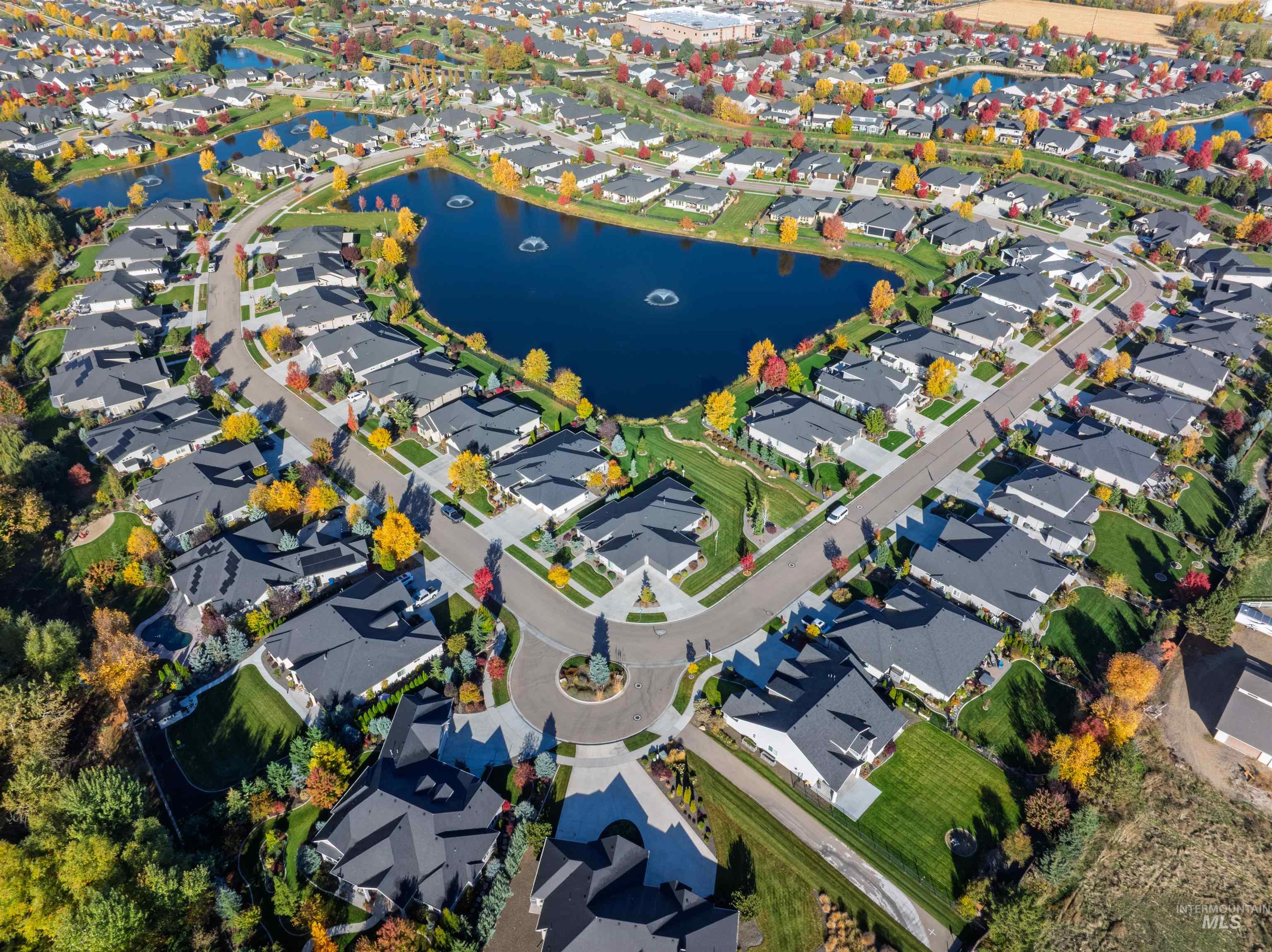 Aerial overview of property's location with a nearby body of water