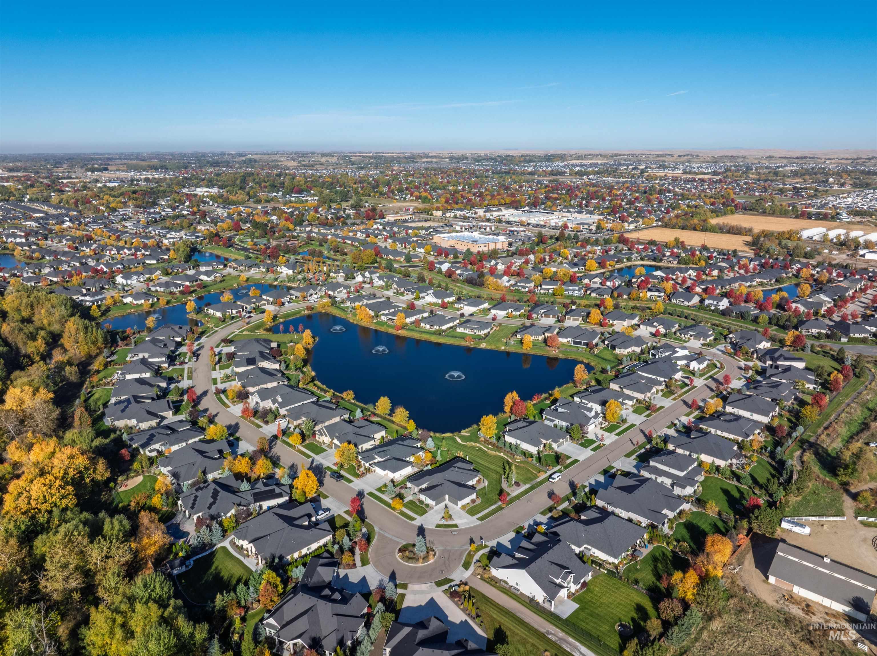 View of property location with a large body of water and nearby suburban area