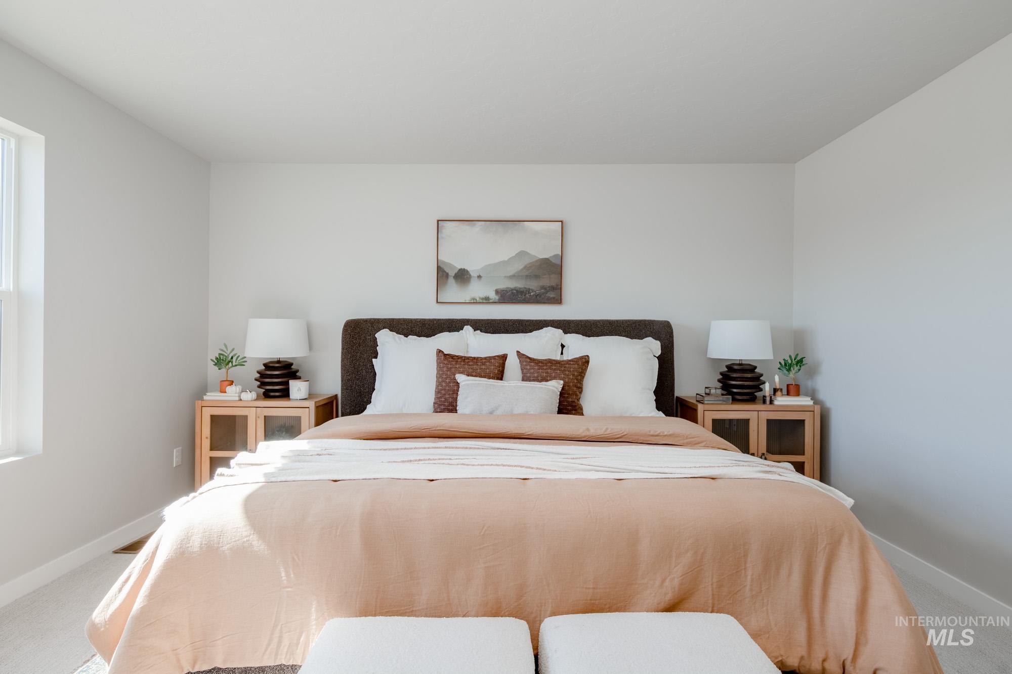 Carpeted bedroom featuring baseboards