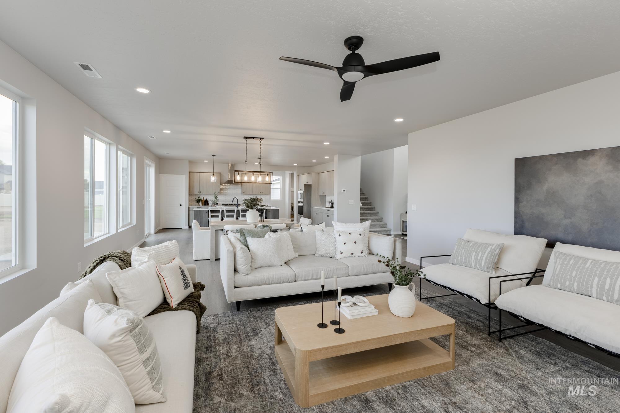 Living area with recessed lighting and ceiling fan