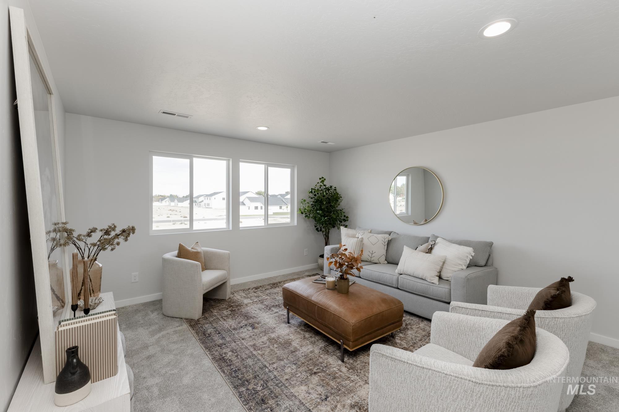 Living room featuring light carpet and recessed lighting