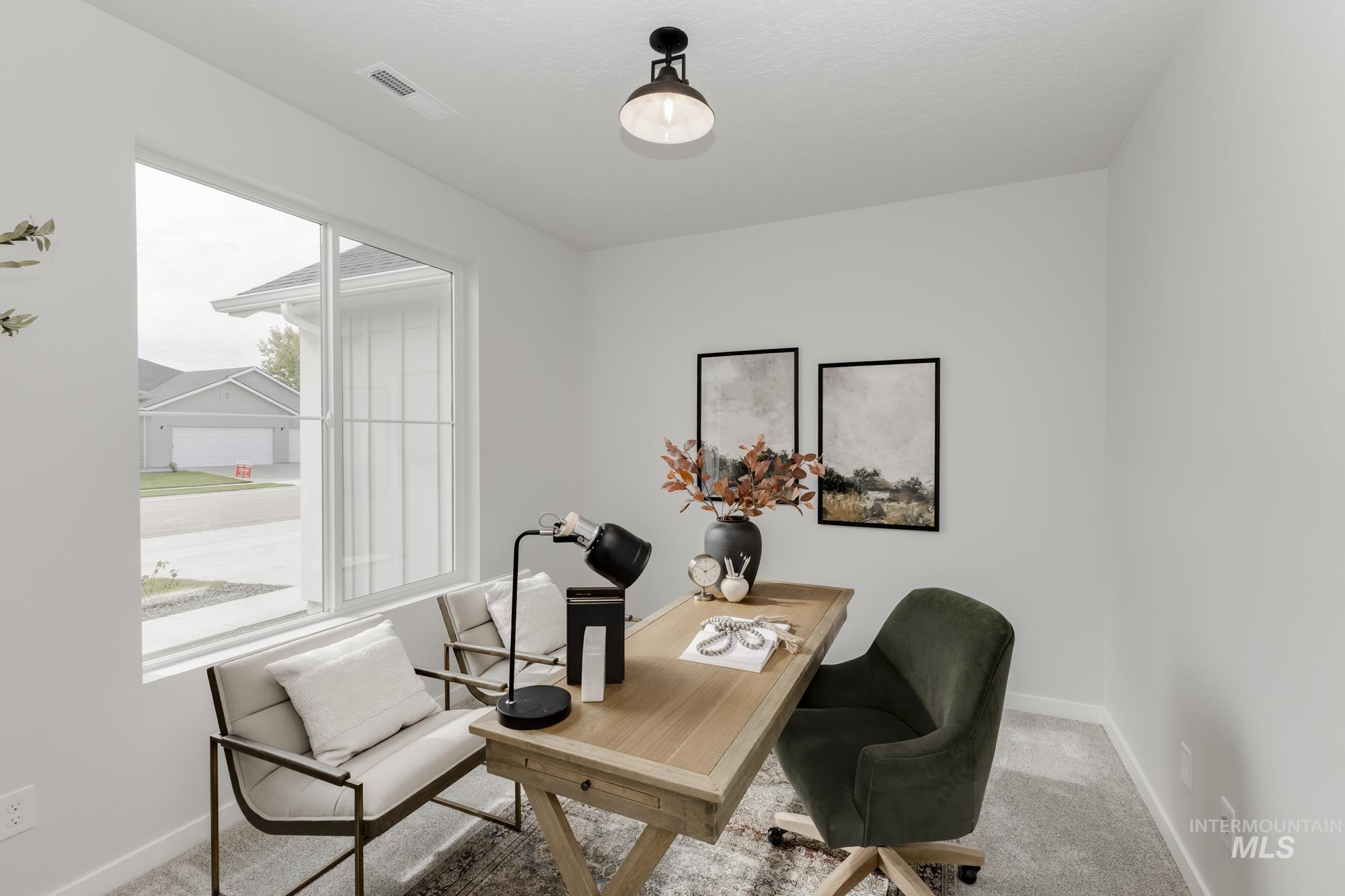 Carpeted office featuring baseboards