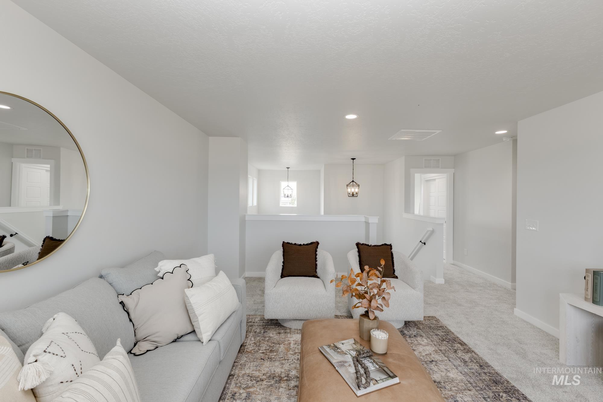 Carpeted living room featuring recessed lighting