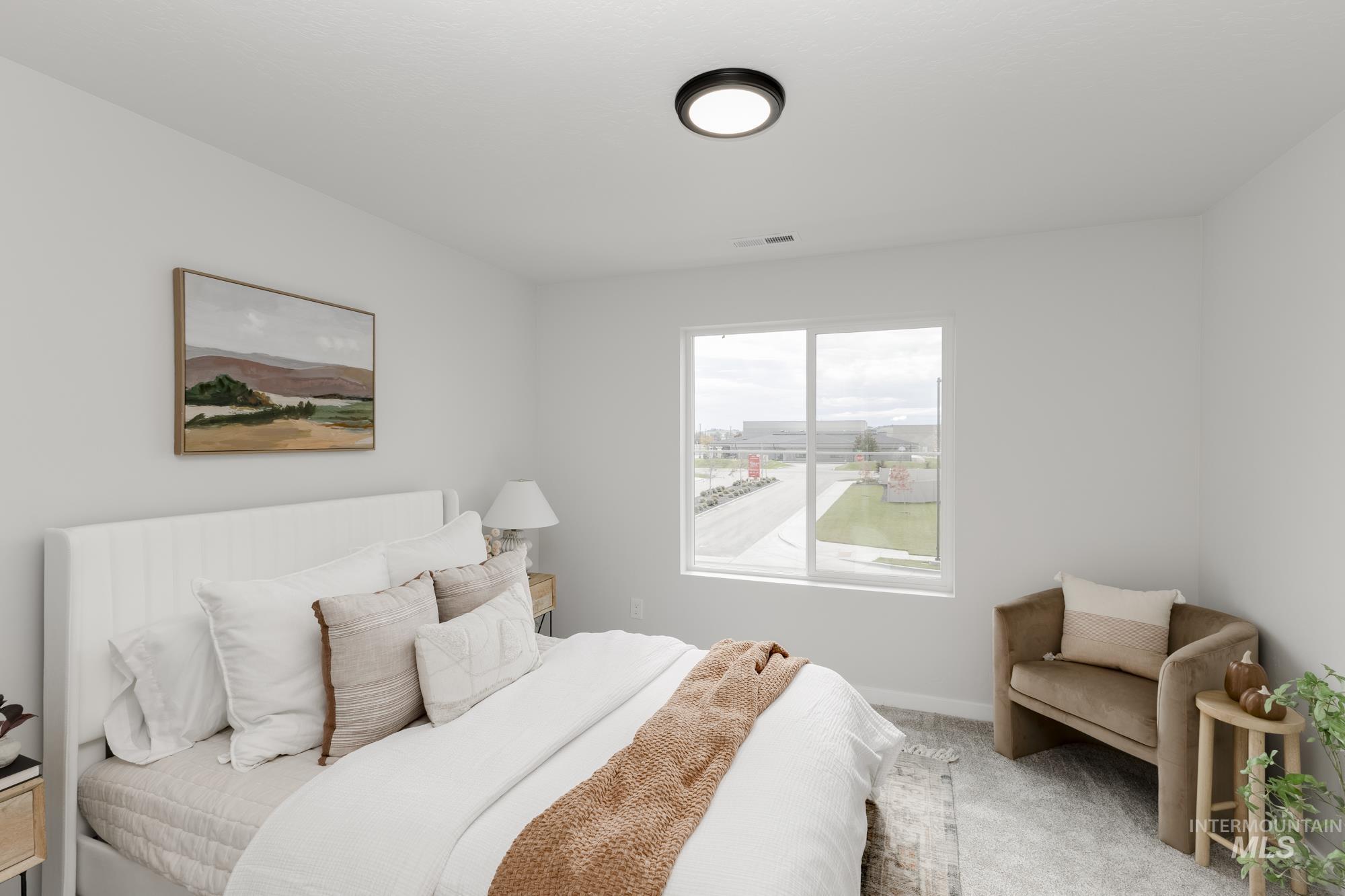 Bedroom with carpet flooring and baseboards