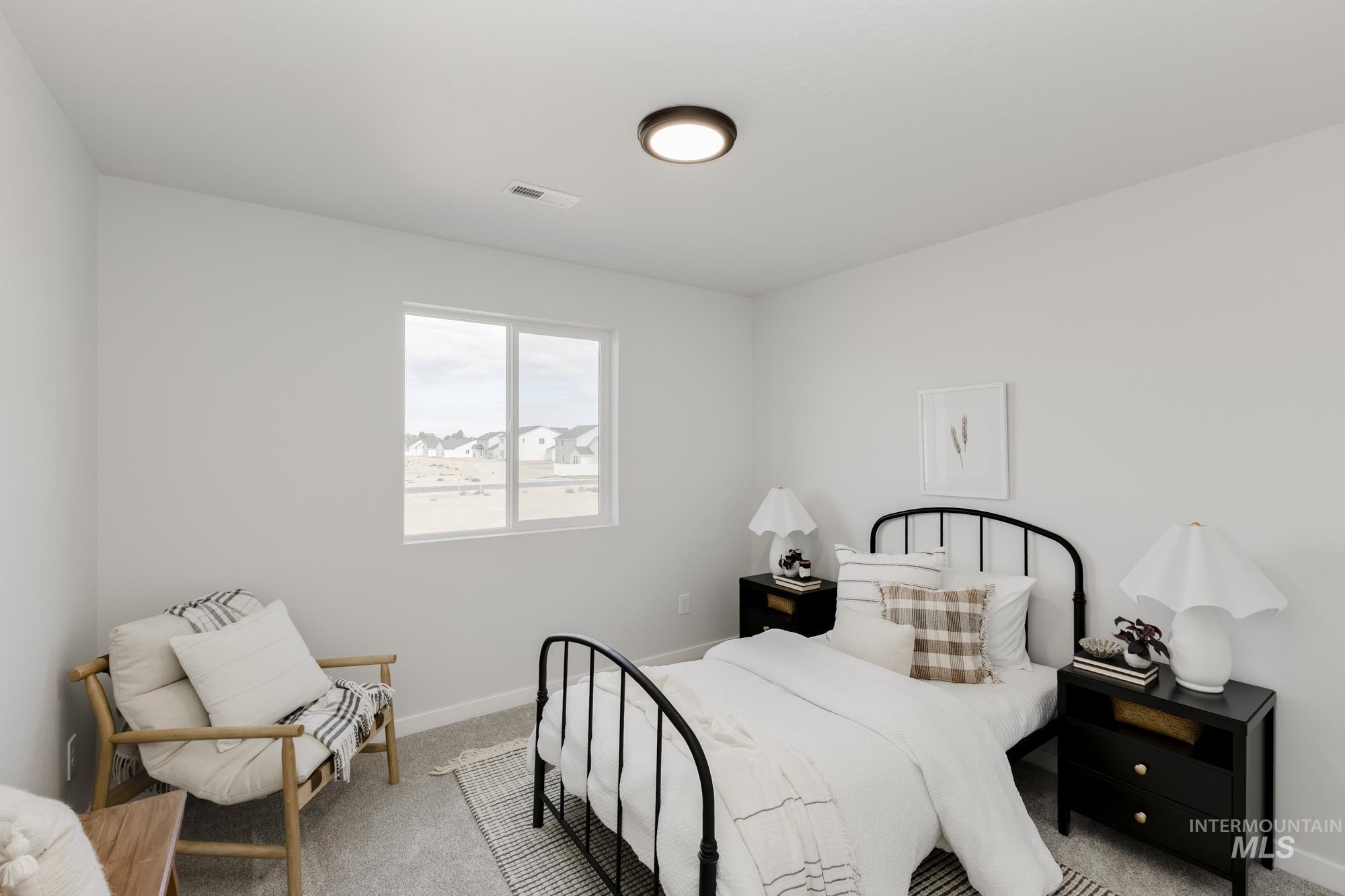 Carpeted bedroom with baseboards