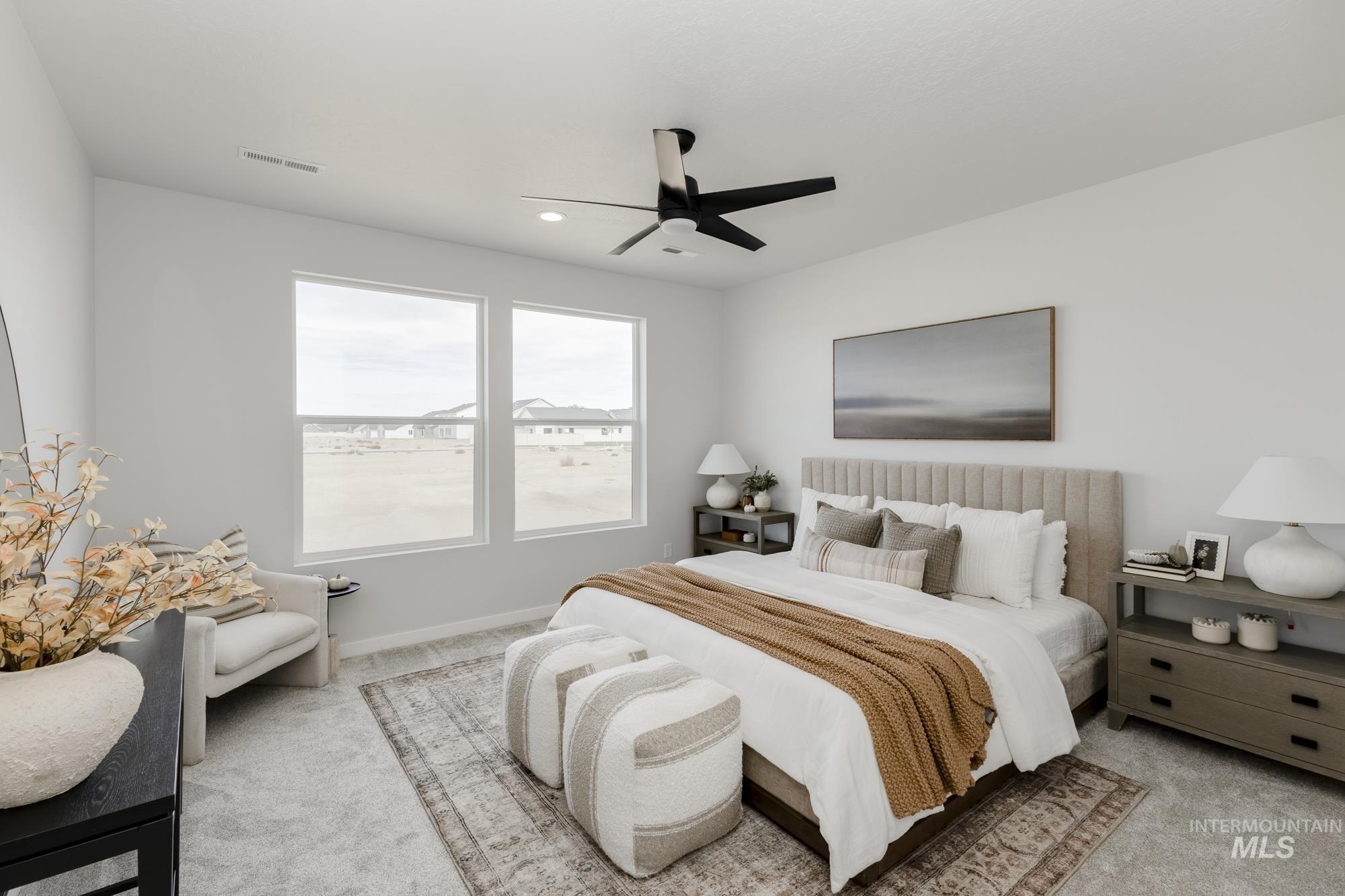 Bedroom featuring light colored carpet, ceiling fan, and recessed lighting