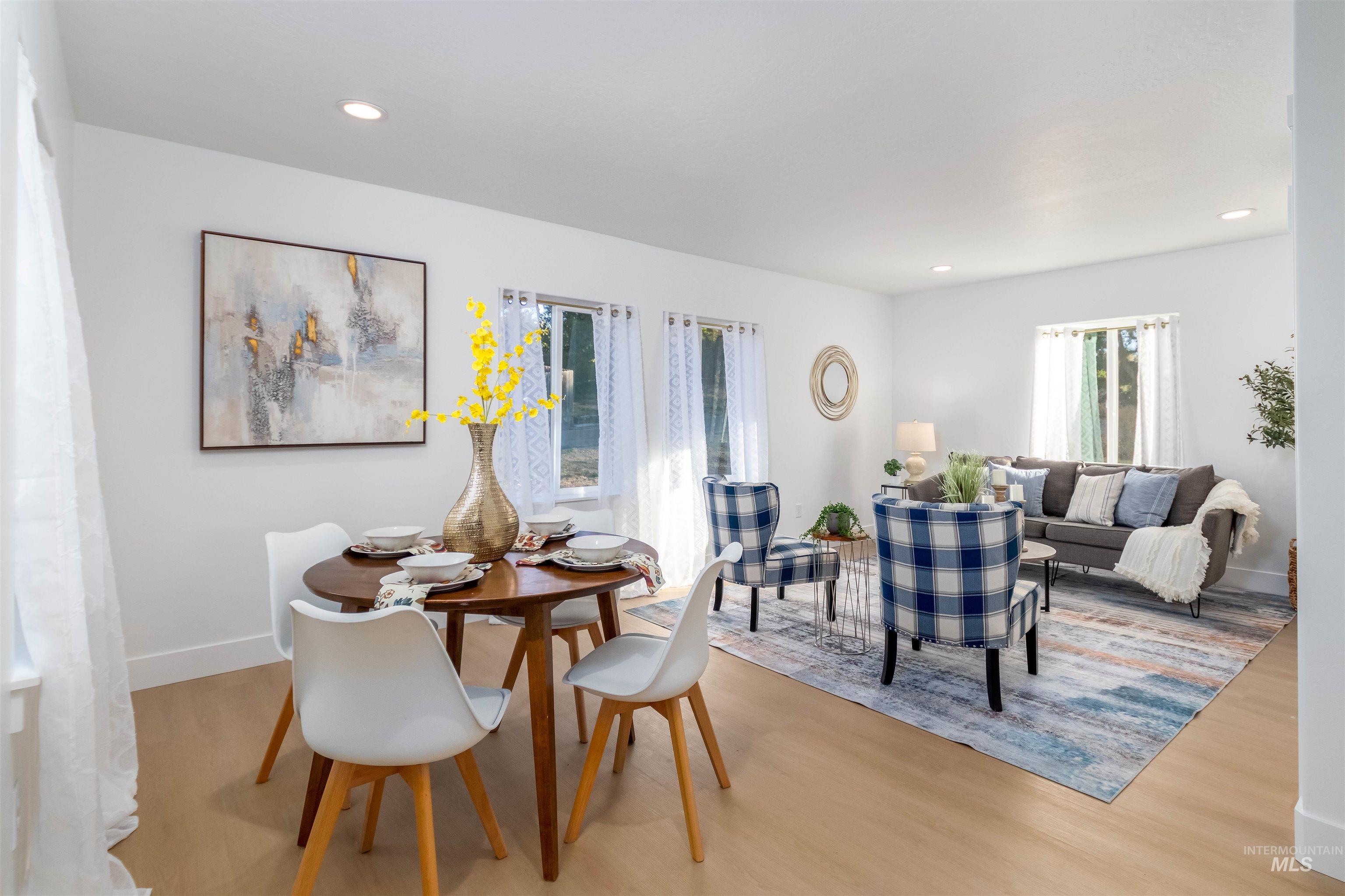 Dining space featuring plenty of natural light, recessed lighting, and wood finished floors