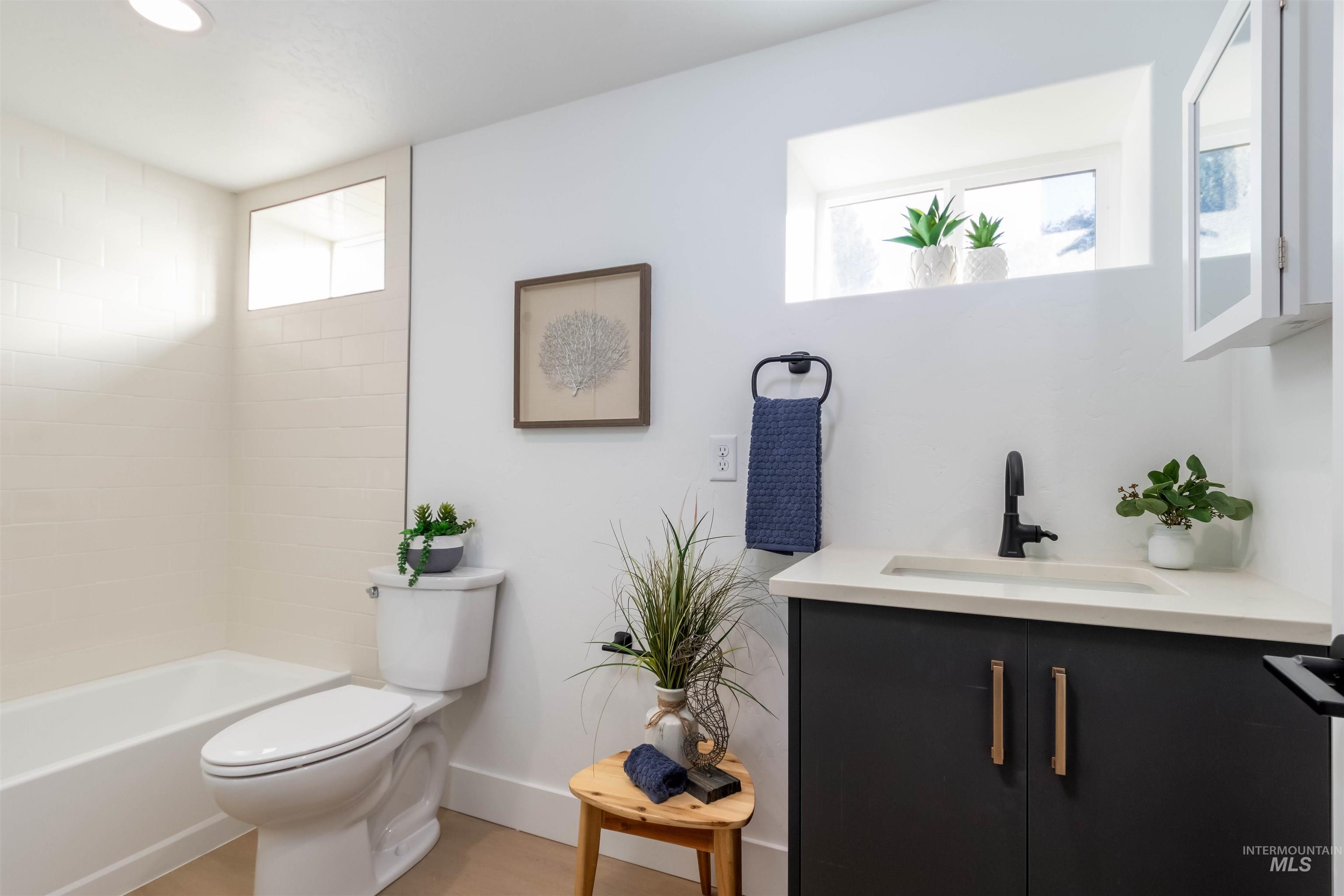 Full bathroom featuring vanity and tub / shower combination