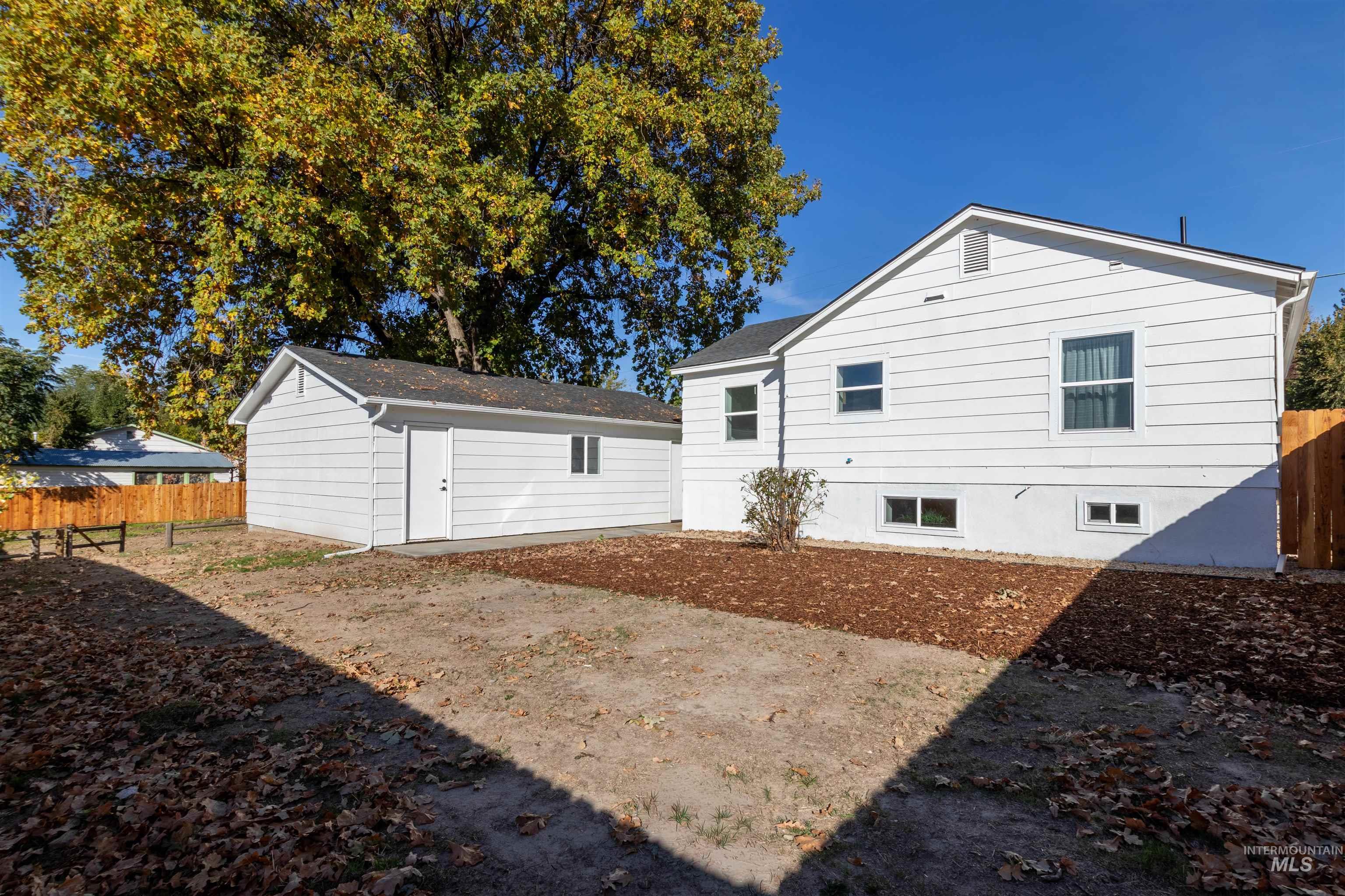 Rear view of house with an outbuilding