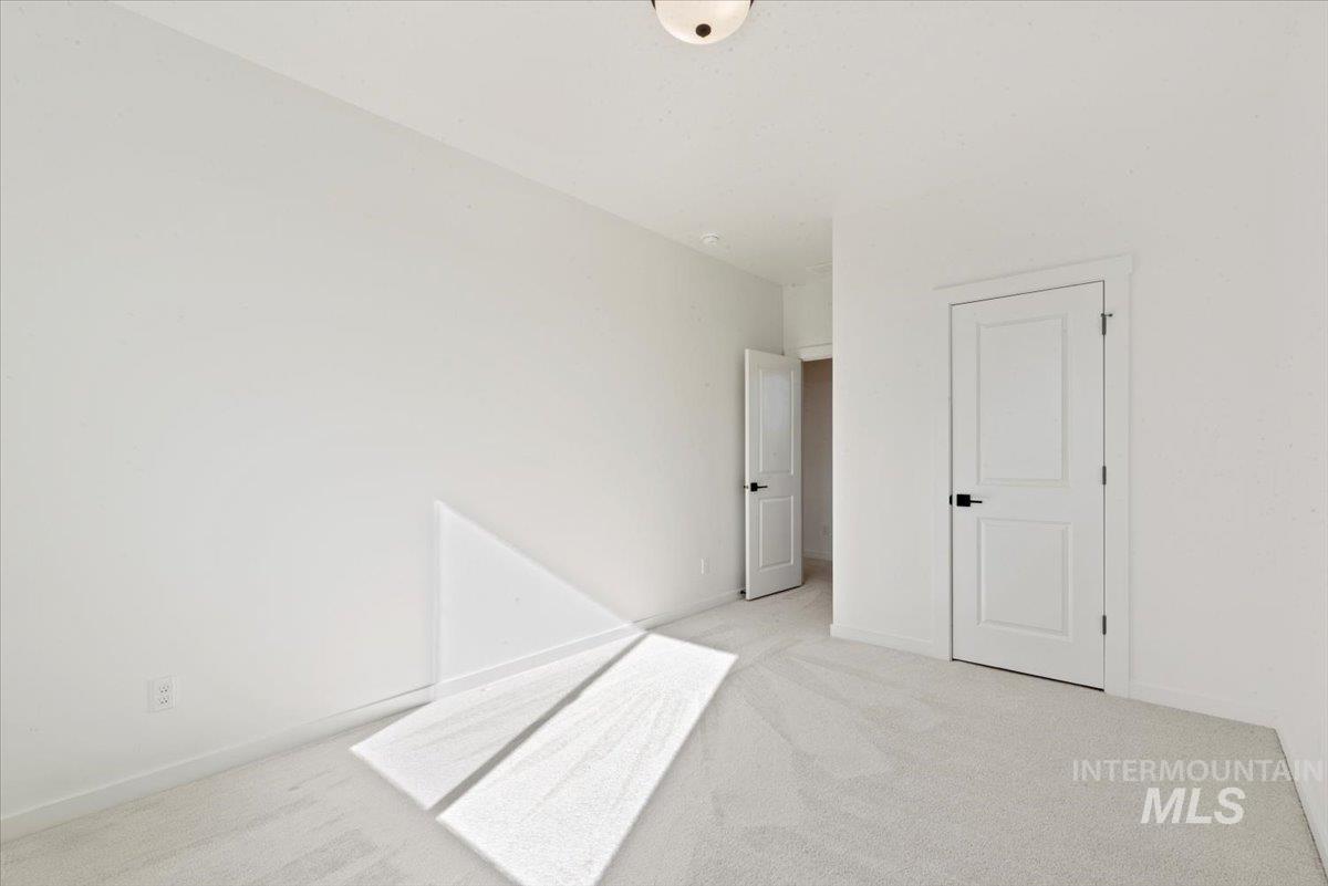 Unfurnished bedroom with carpet floors