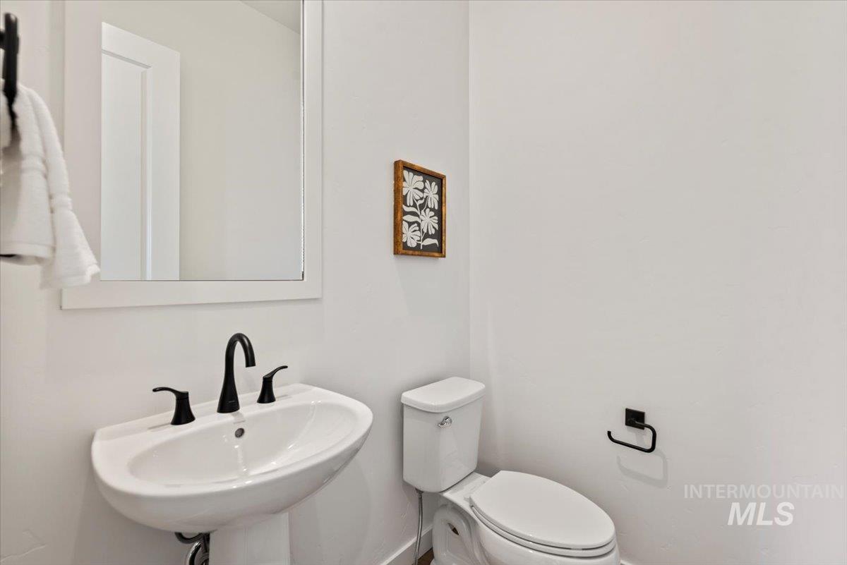 Bathroom with toilet and baseboards