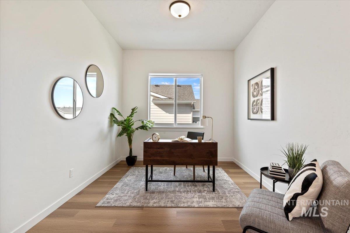 Office space featuring light wood-type flooring and baseboards