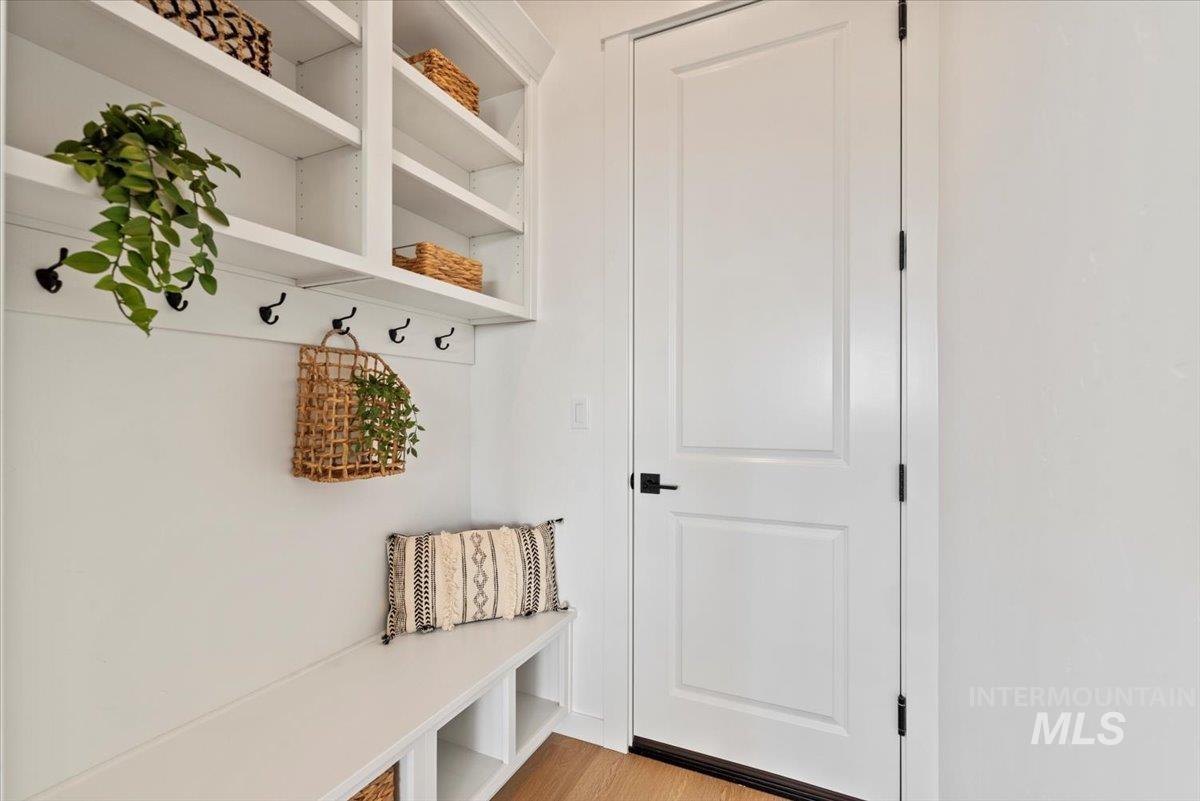 Mudroom featuring light wood-style floors