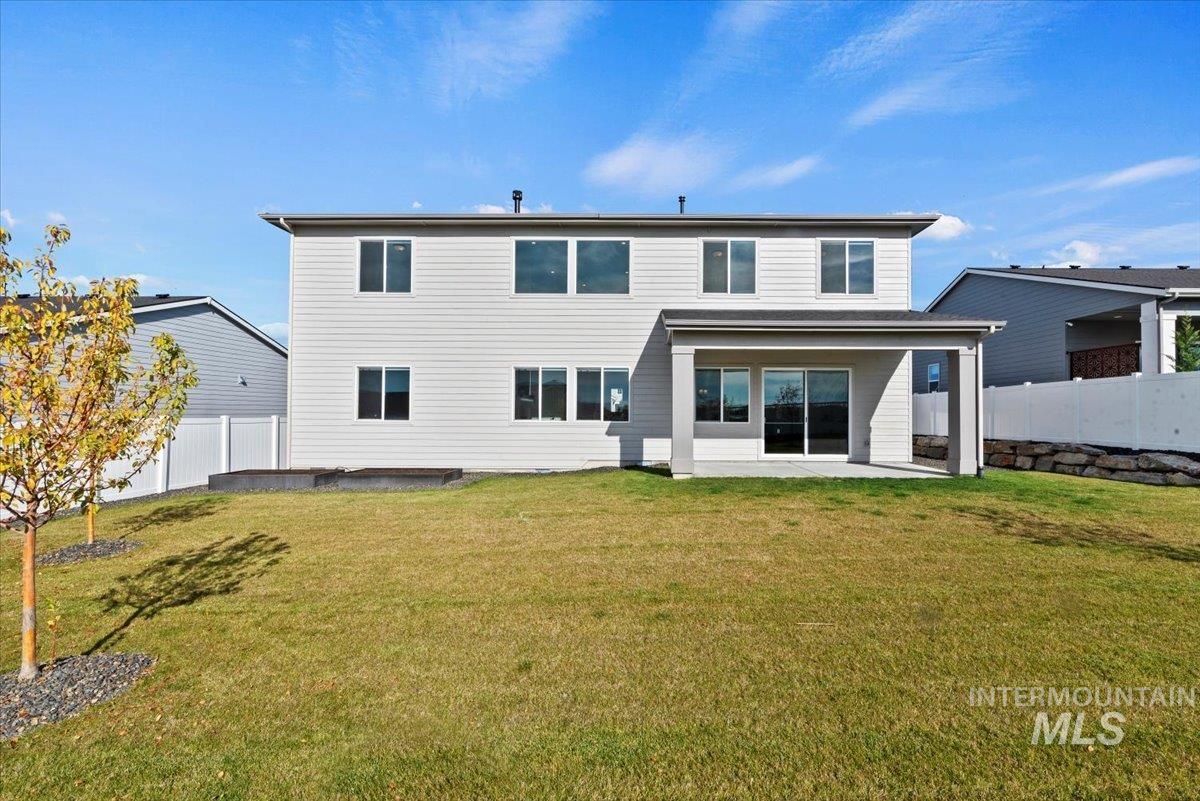 Back of house featuring a patio area and a fenced backyard