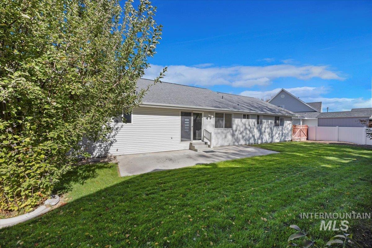 Back of property with a patio and entry steps
