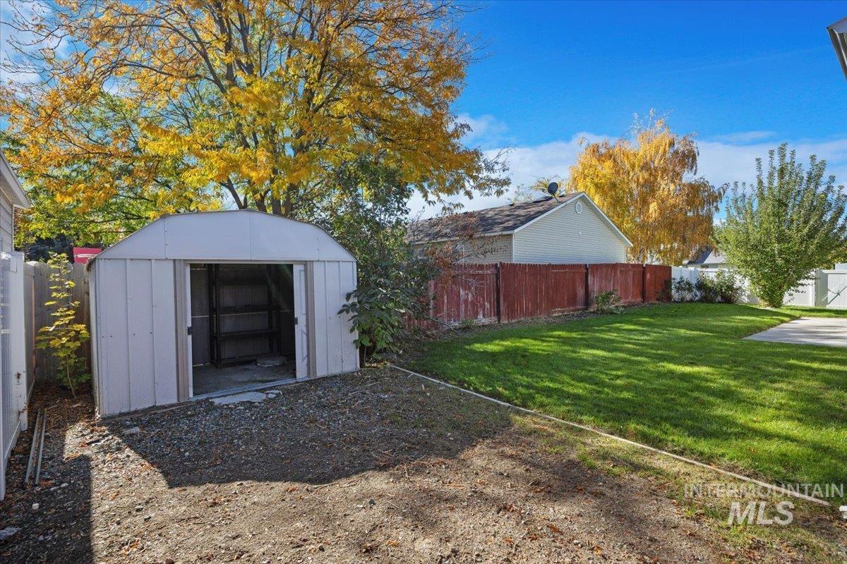View of shed featuring a fenced backyard