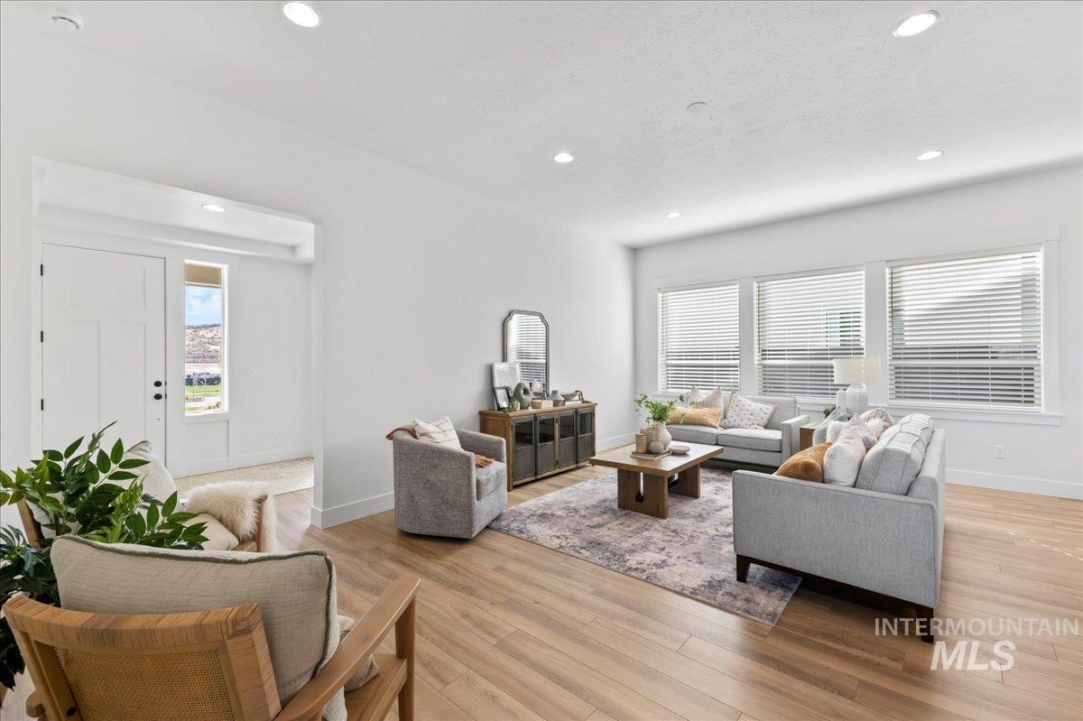 Living room featuring light wood-style floors and recessed lighting