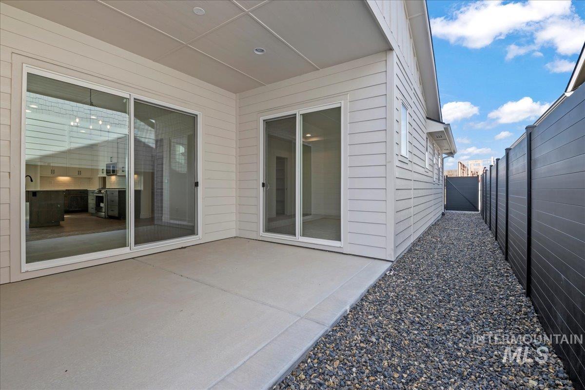 View of patio with a gate