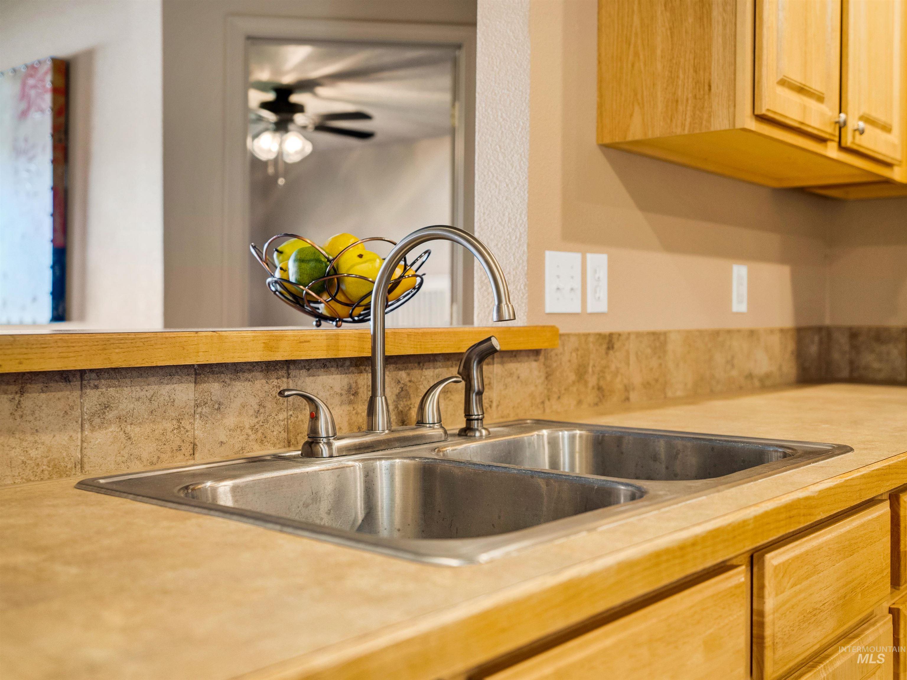 Kitchen with light countertops and light brown cabinets