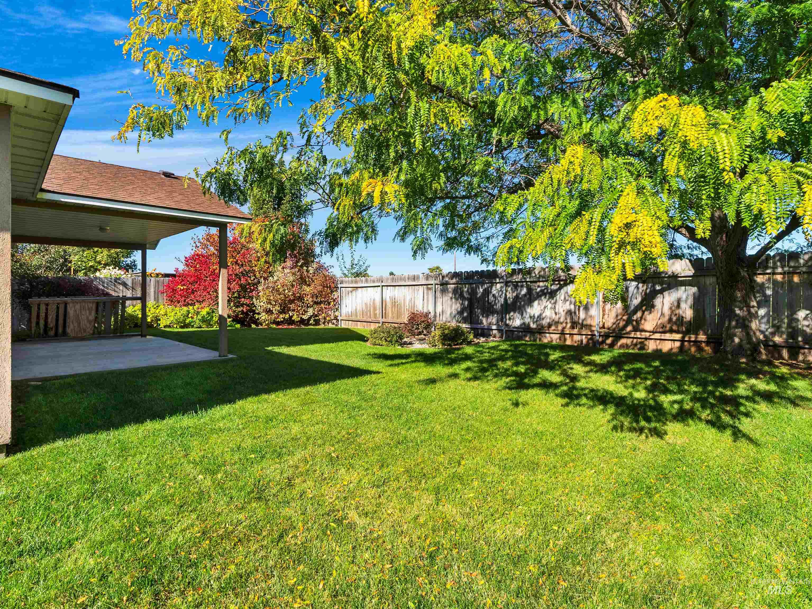 Fenced backyard featuring a patio area