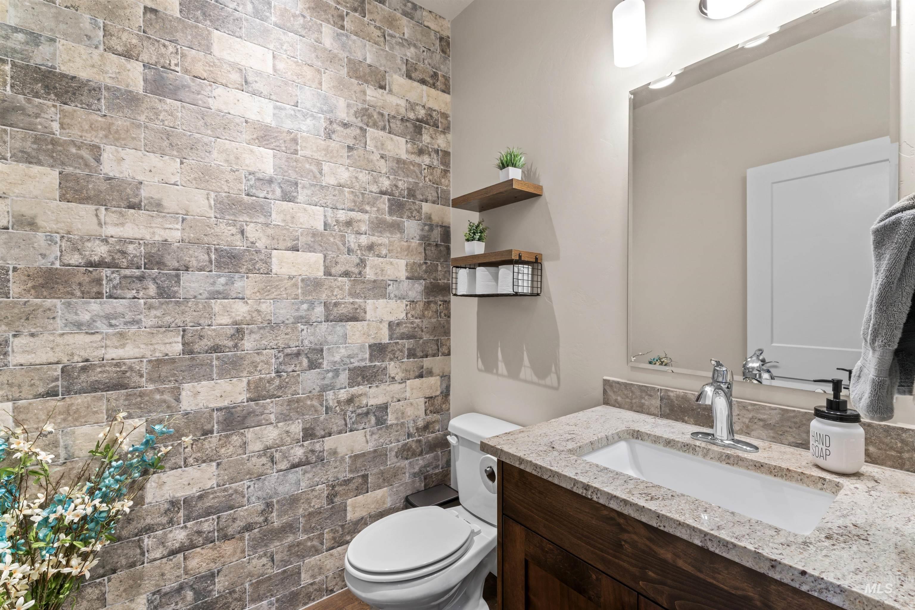 Bathroom with toilet and vanity