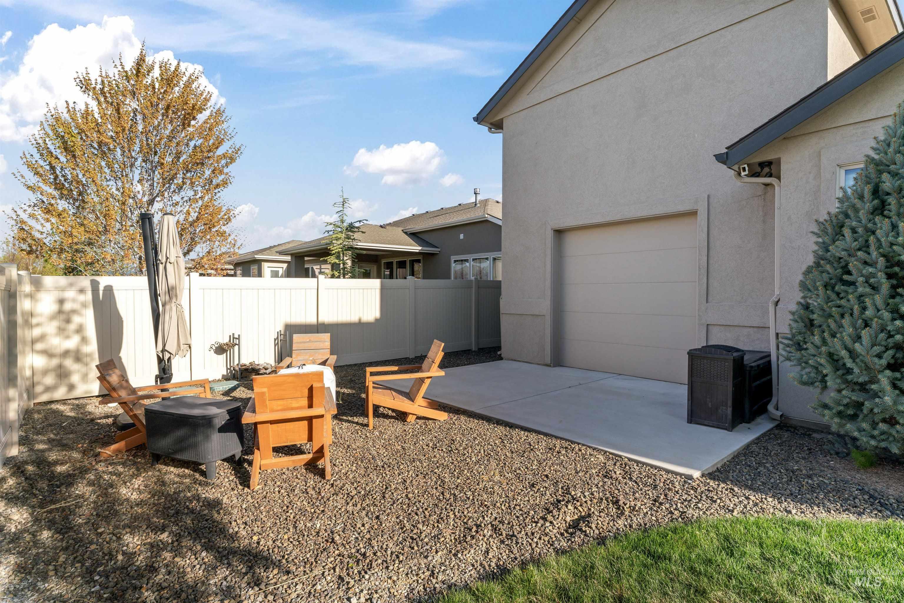 View of yard featuring a patio area and a garage