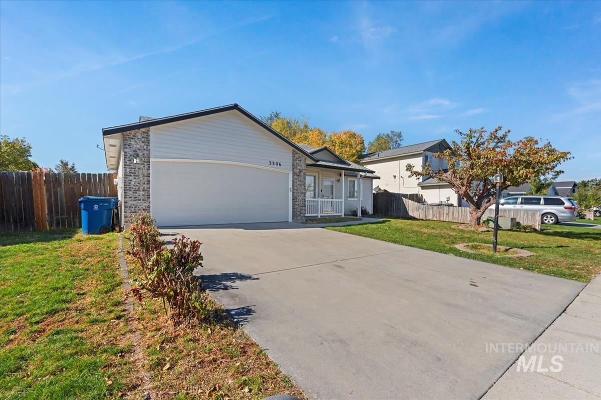 View of home's exterior with concrete driveway and a garage