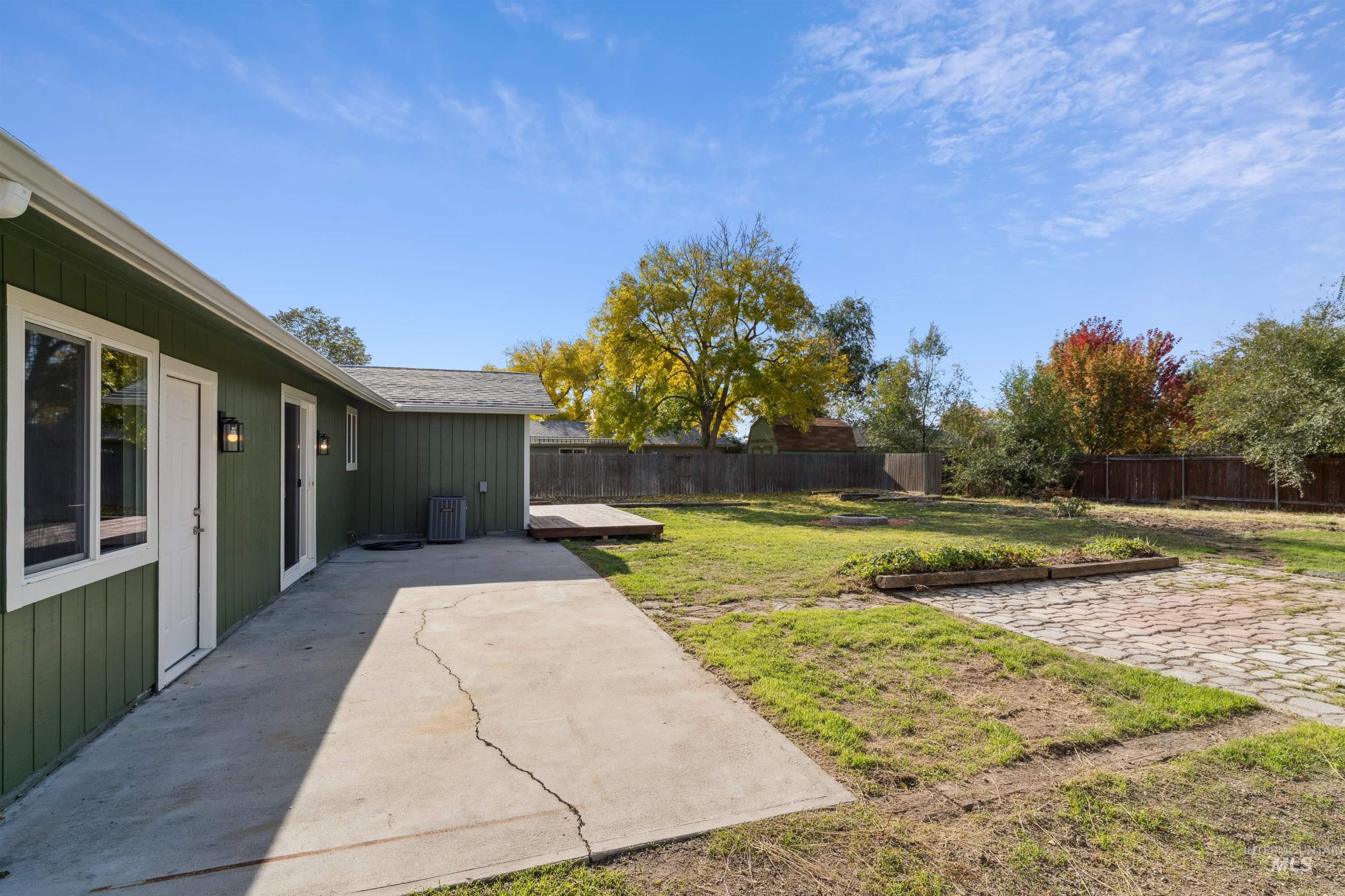 Fenced backyard featuring a patio area