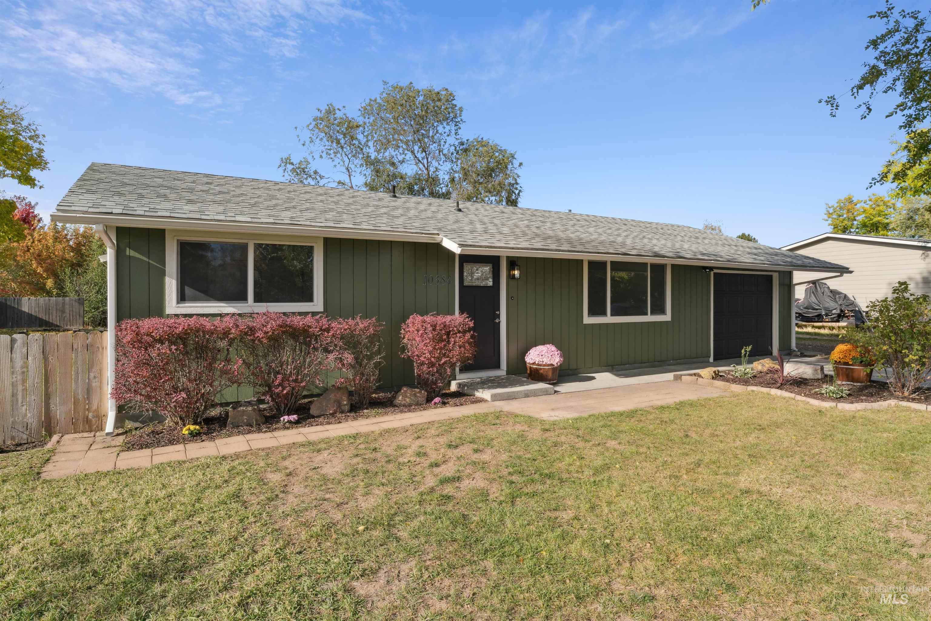 Ranch-style home featuring roof with shingles