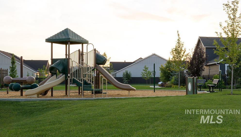 Community jungle gym with a lawn