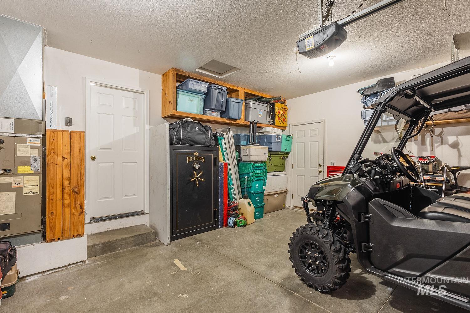 Garage with a garage door opener and heating unit