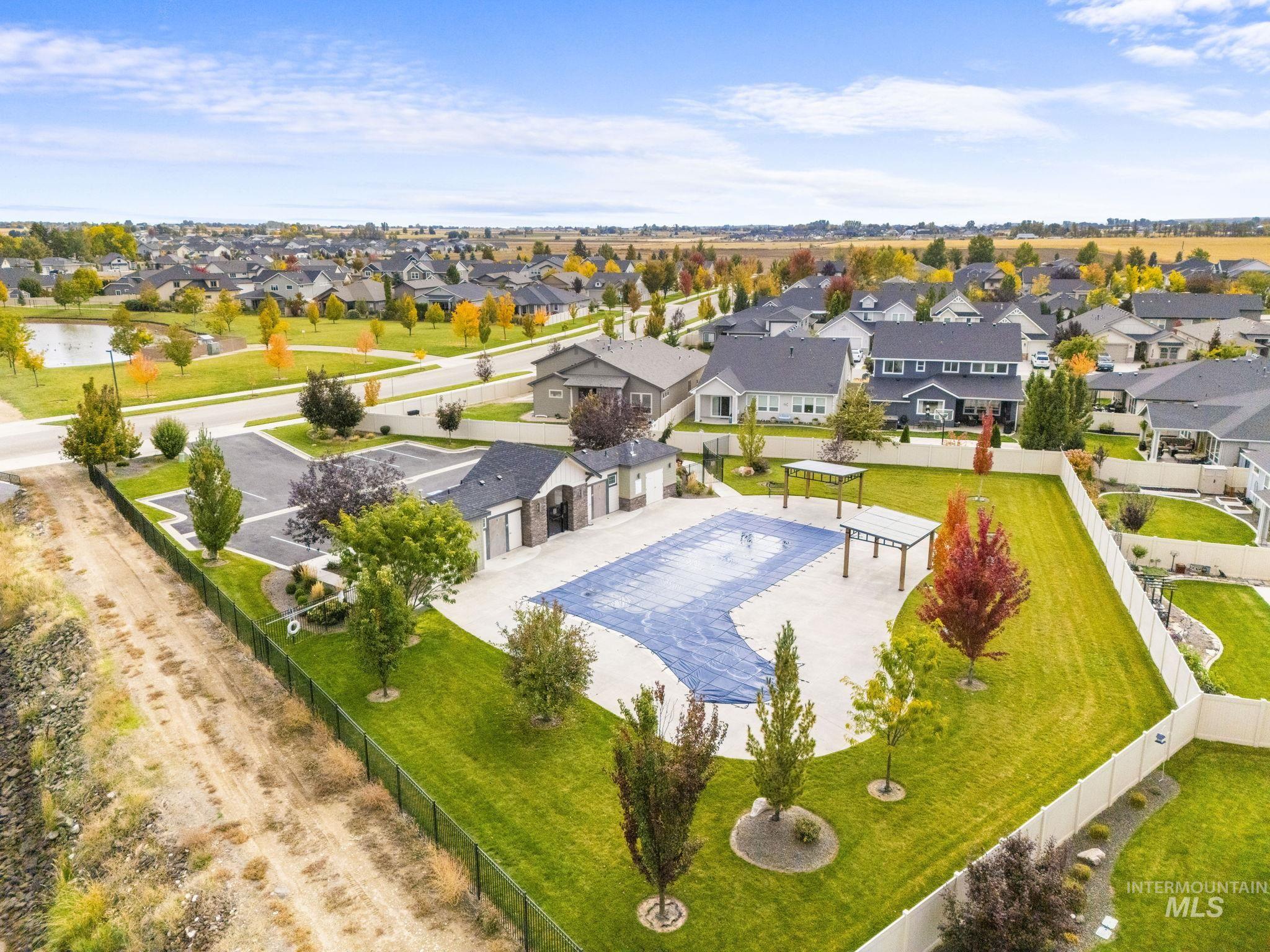 Aerial perspective of suburban area with a pool