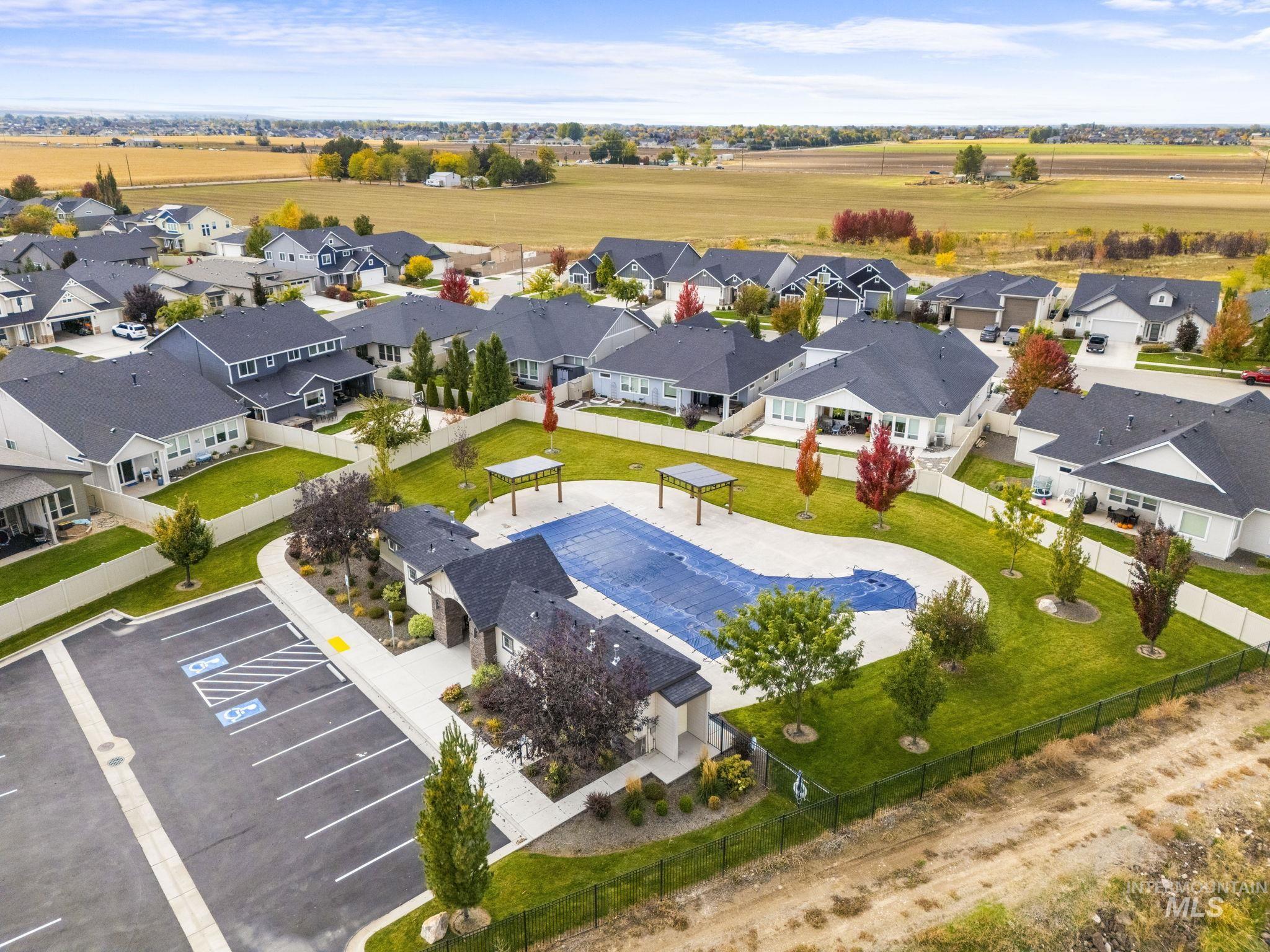 Aerial perspective of suburban area with a pool area