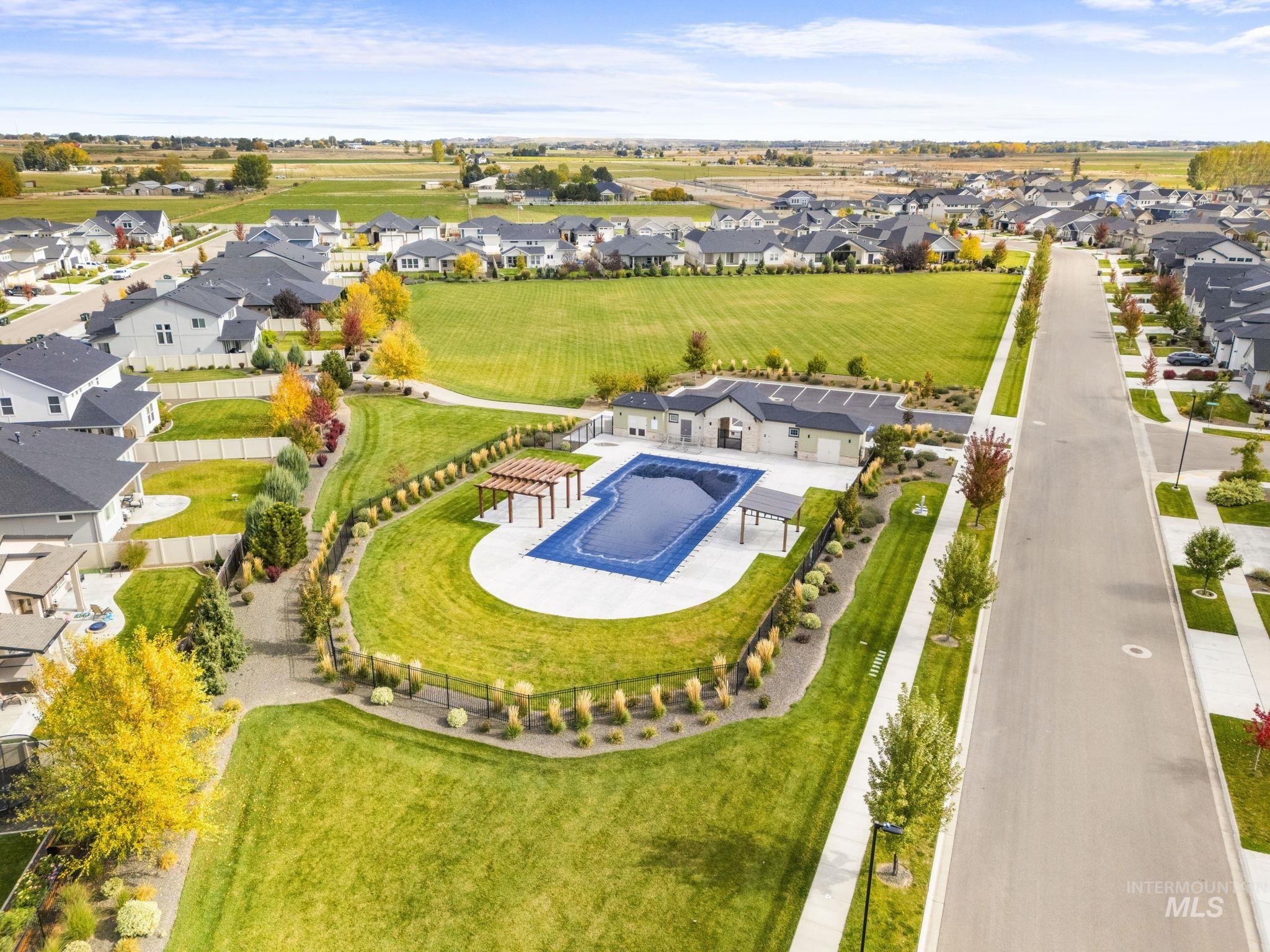 Aerial perspective of suburban area with a pool area