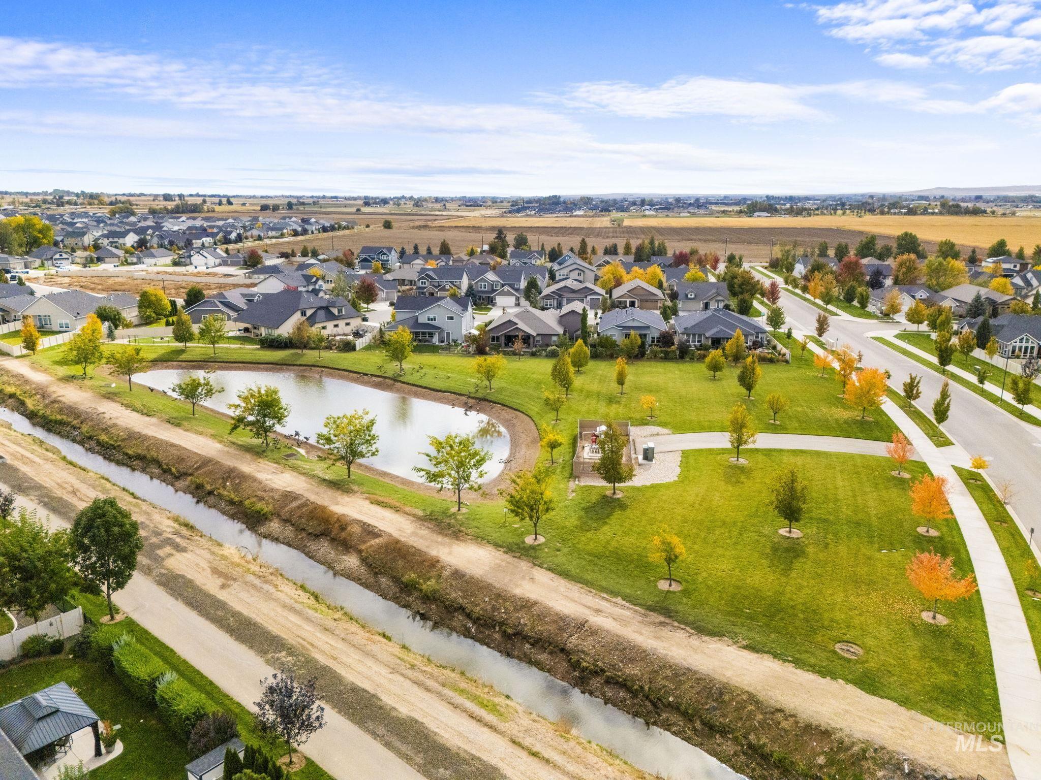 Aerial perspective of suburban area with a nearby body of water
