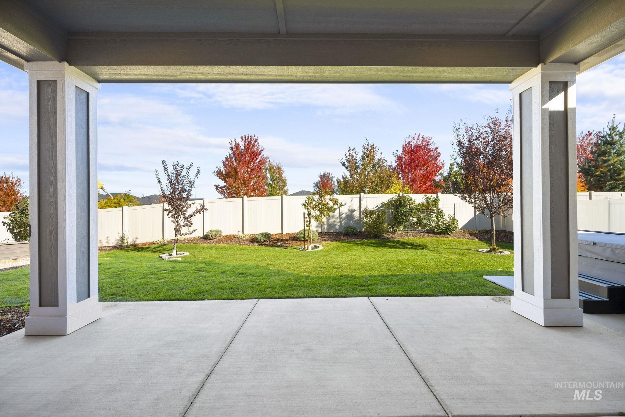 Fenced backyard with a patio area