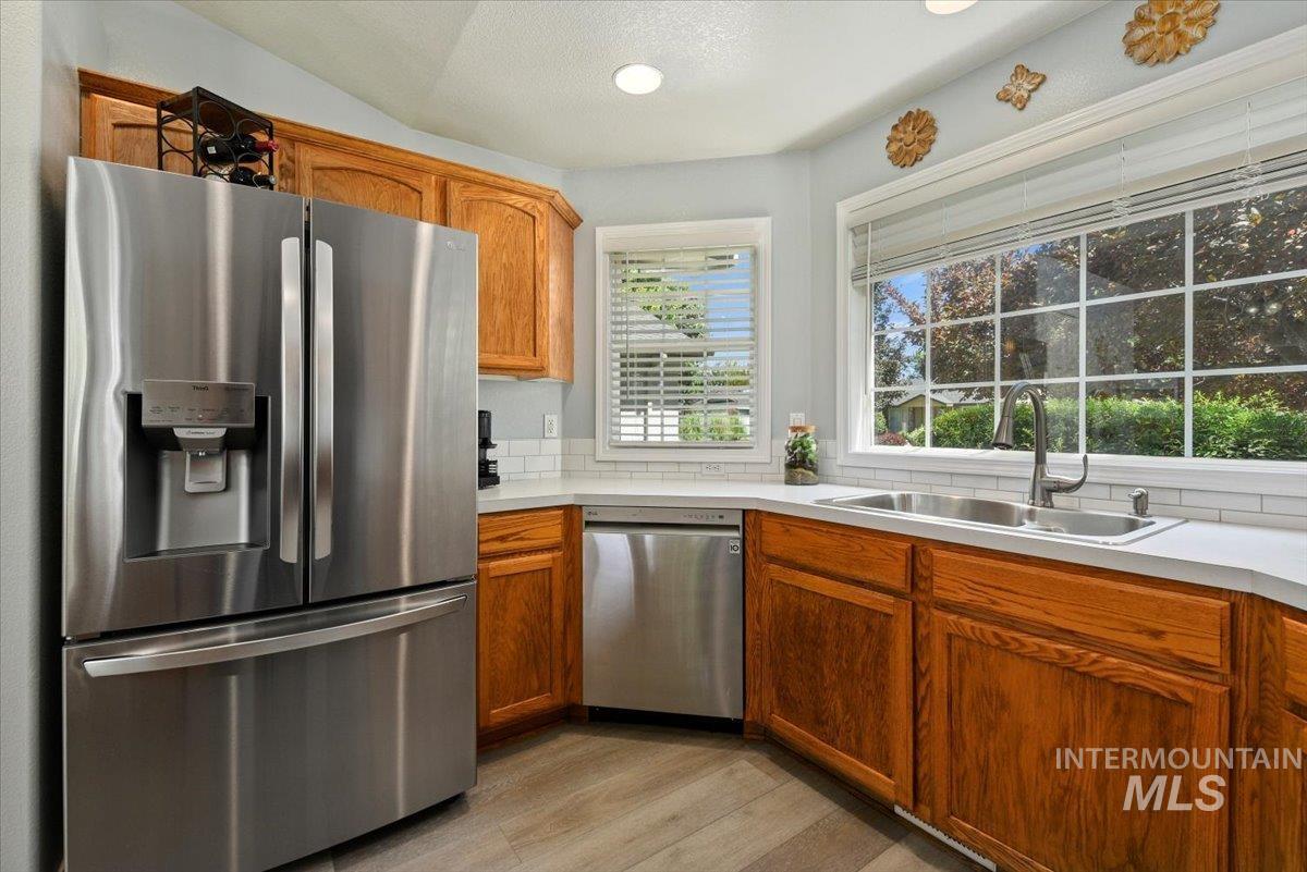 New stainless appliances and sink, refrigerator included