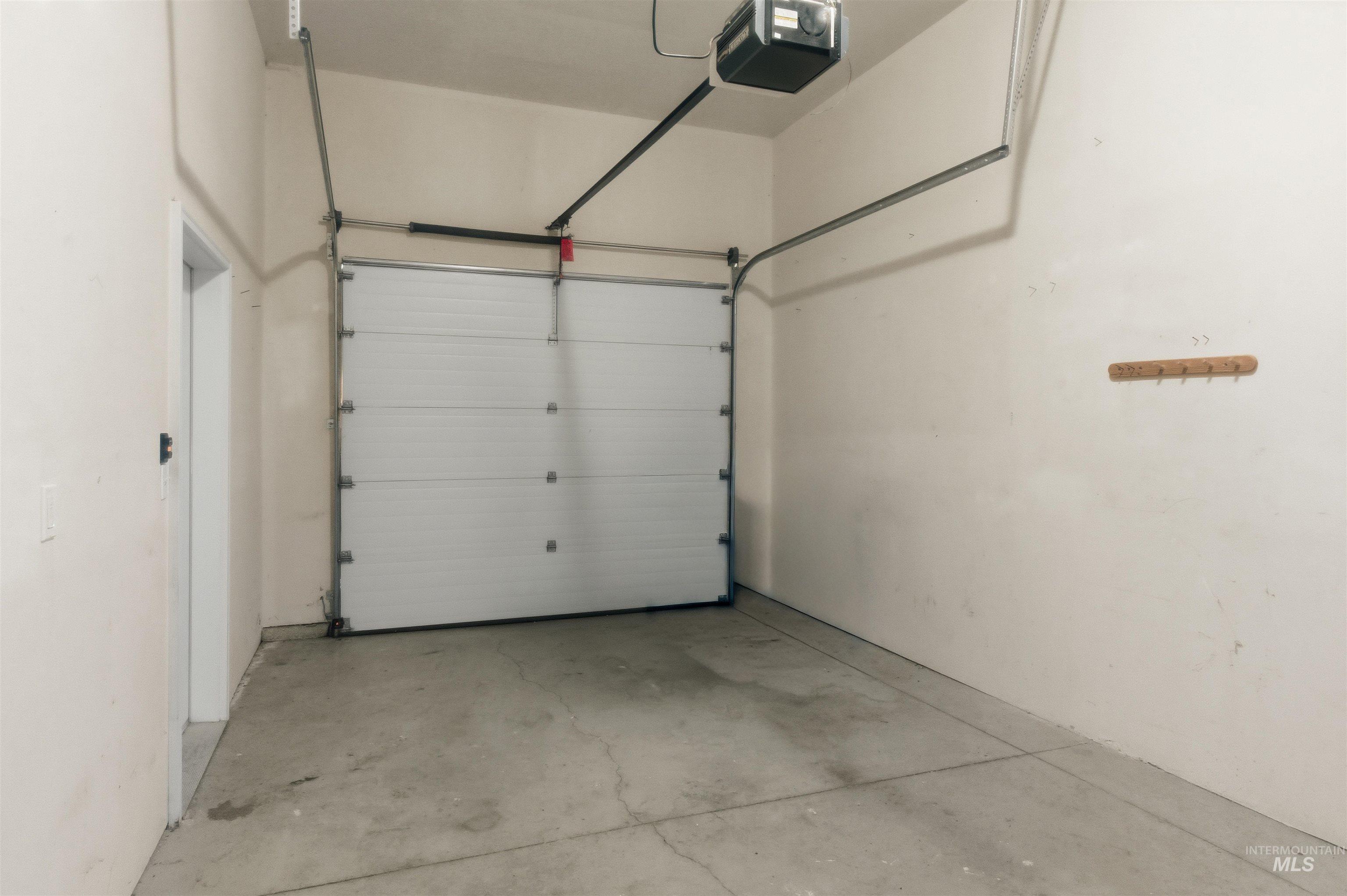 Garage featuring a garage door opener